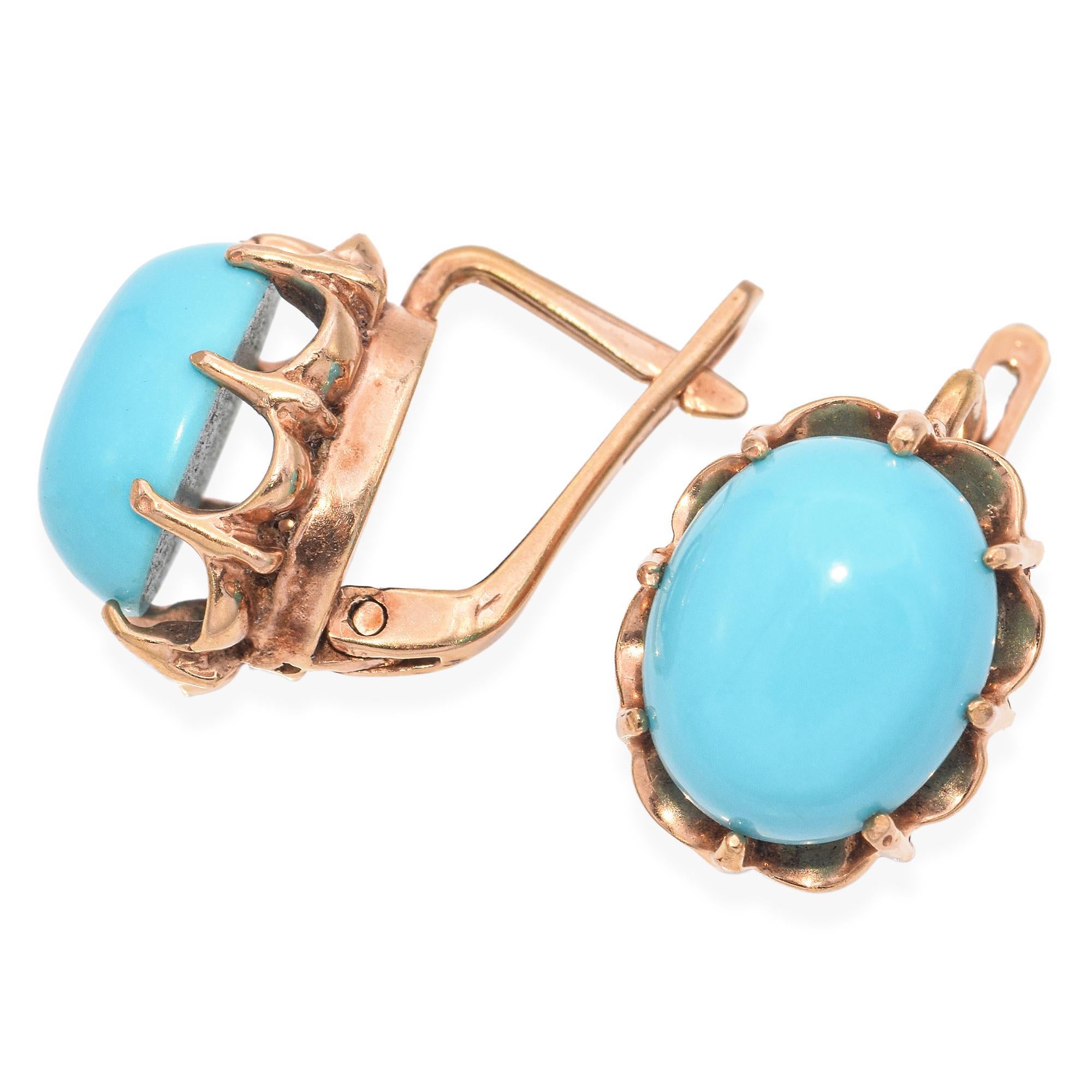 Experience the refined charm of these Turquoise Earrings. They feature vibrant turquoise cabochons, set in a warm gold-toned scalloped bezel. Each earring showcases a smooth, oval turquoise stone, exuding a serene blue hue. The design is a