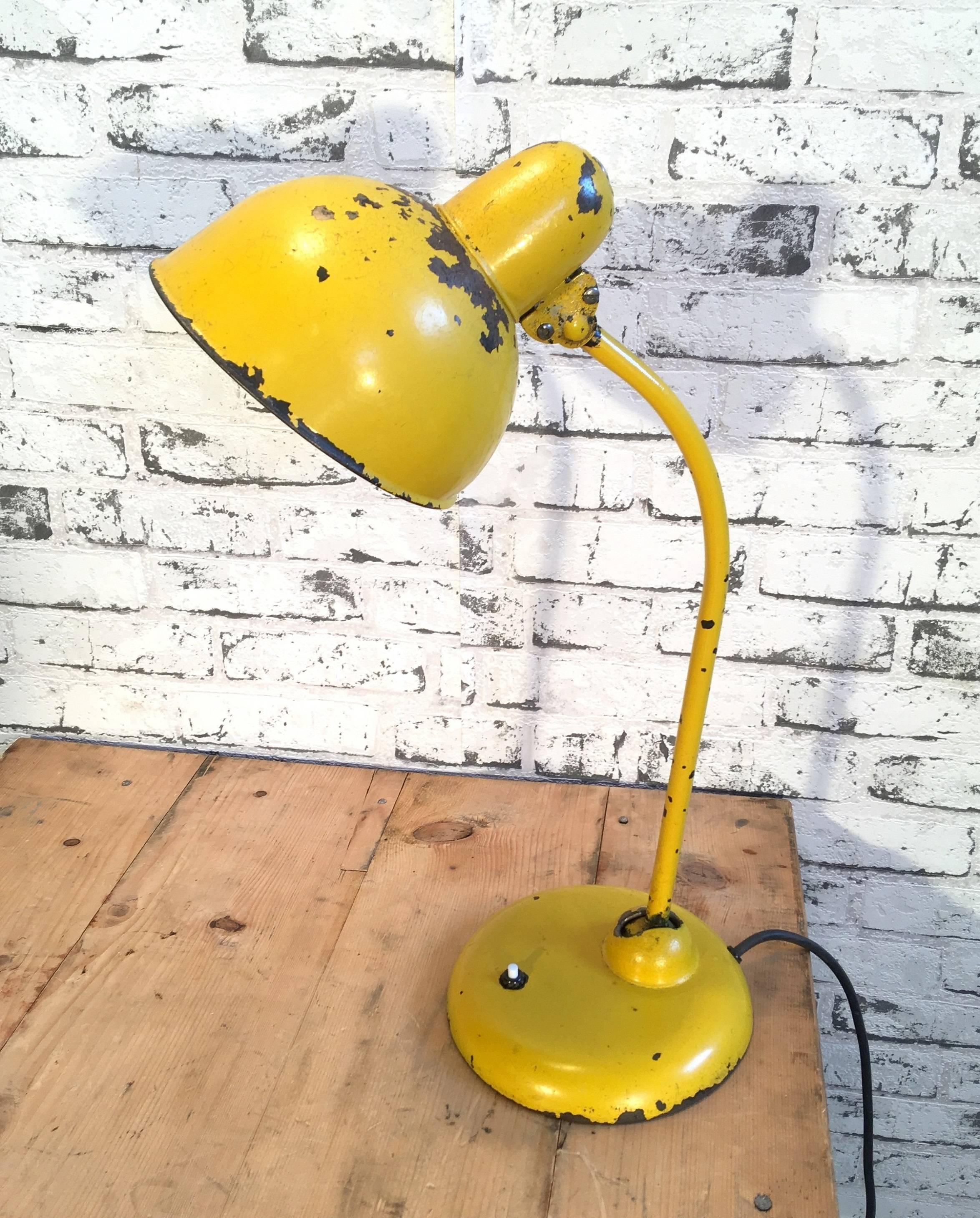 Vintage yellow table lamp from 1950s in Bauhaus style. Cast Iron base.
Iron shade. The arm and shade are adjustable. Very nice patina. Fully functional.
     