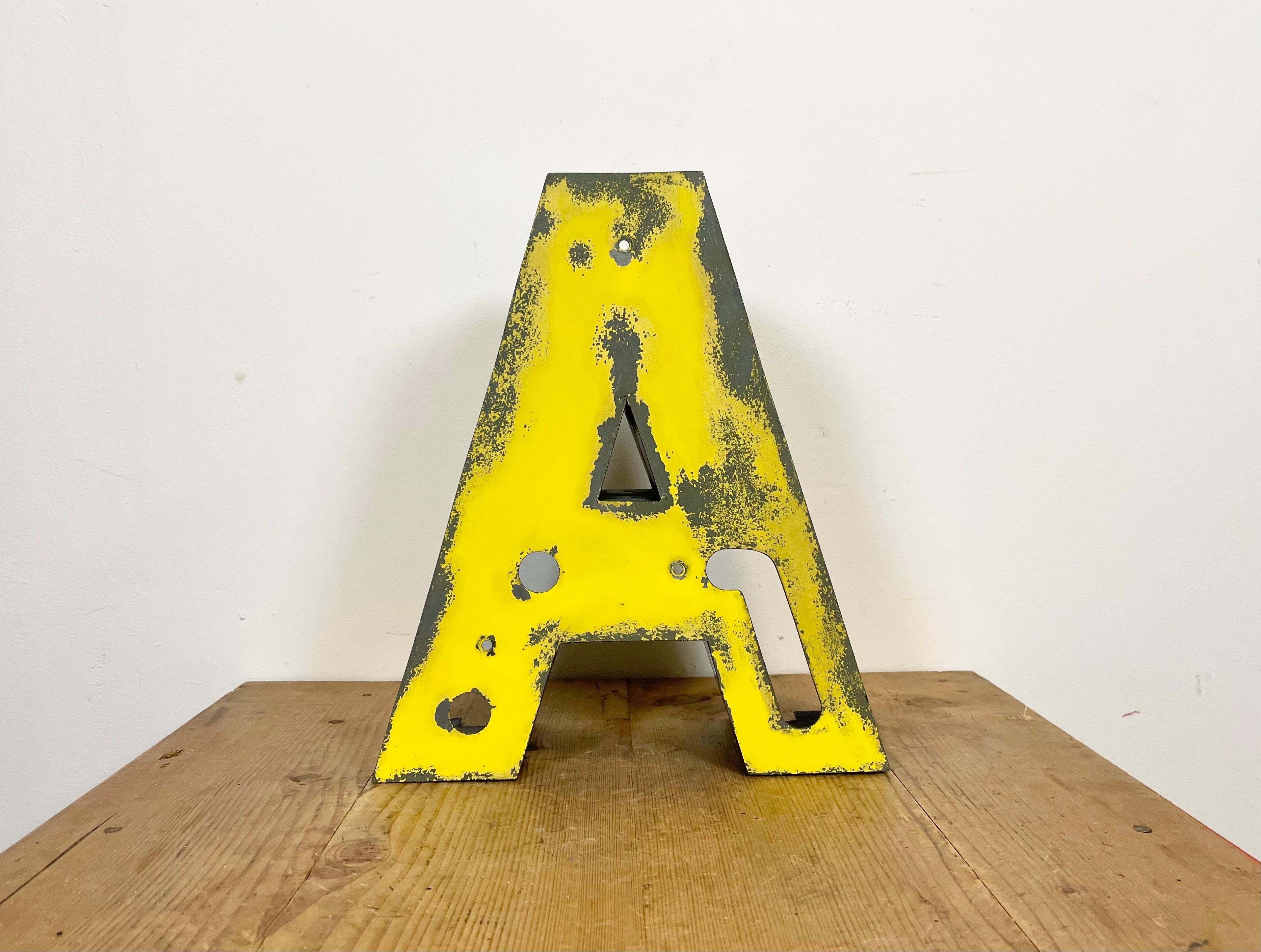 This vintage industrial letter A was made during the 1970s and comes from the old advertising banner. The weight of the letter is 2 kg.