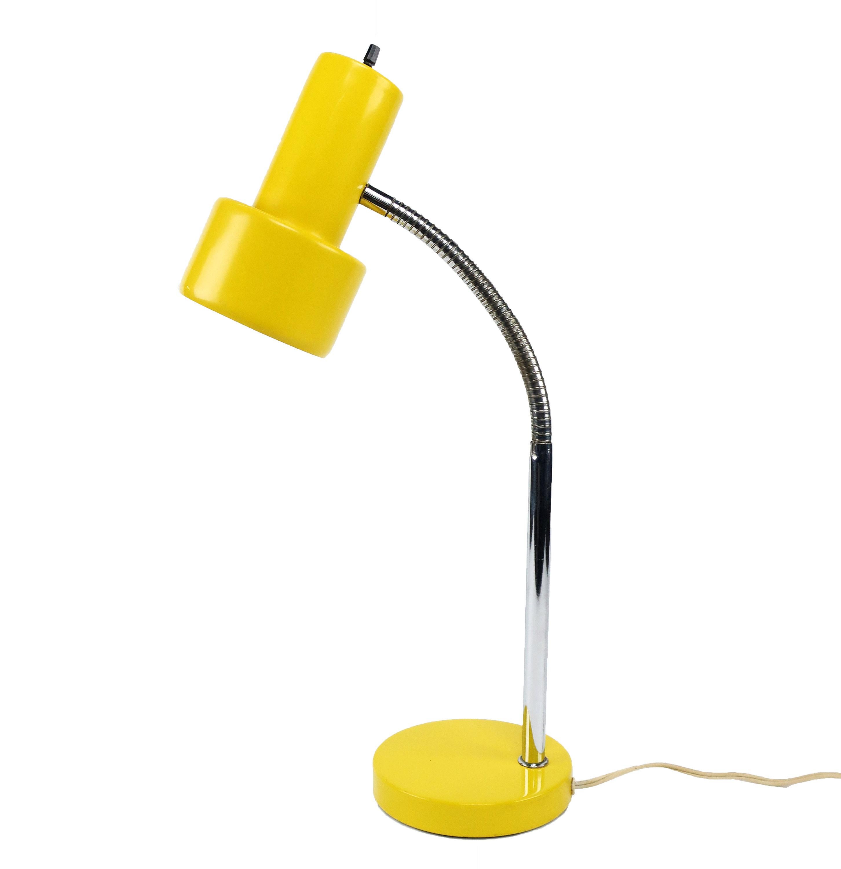 A lovely Mid-Century Modern desk lamp with yellow metal base/shade and chrome stem/gooseneck. Perfect for an office or as accent lighting. In excellent vintage condition with wear consistent with age . 

5.5