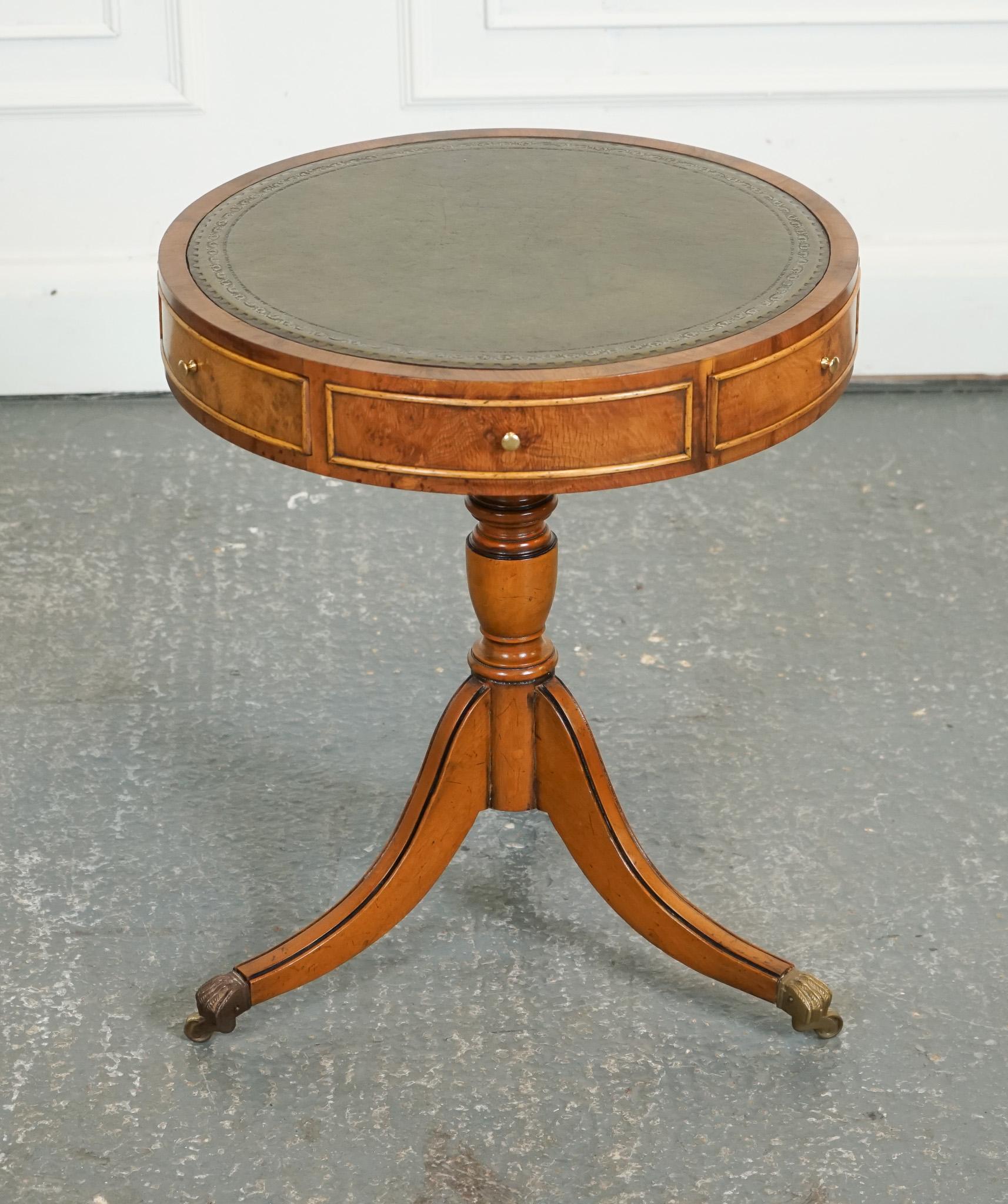 

We are delighted to offer for sale this Vintage Yew Wood Drum Table With Green Leather Top.

The Vintage Yew Wood Drum Table with Green Leather Top is a stunning piece that exudes timeless elegance and sophistication. Crafted with meticulous