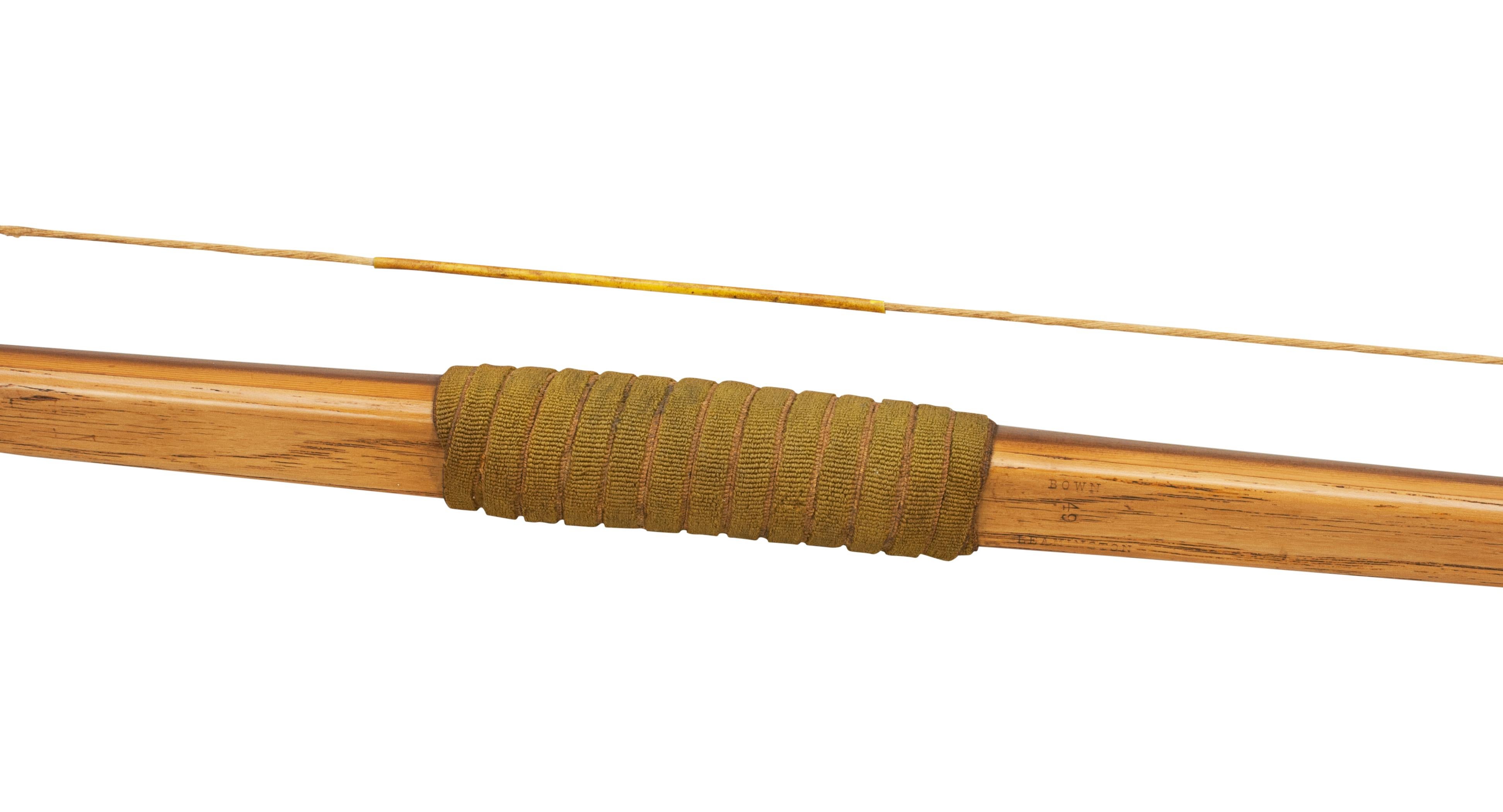 A very good archery yew-wood bow produced by Mr. Bown, the bow-maker from Leamington Spa. The bow is fitted with Horn nocks, green fabric handle with a mother - of - pearl arrow plate (sometimes called an Arrow Pass). Just above the grip is the