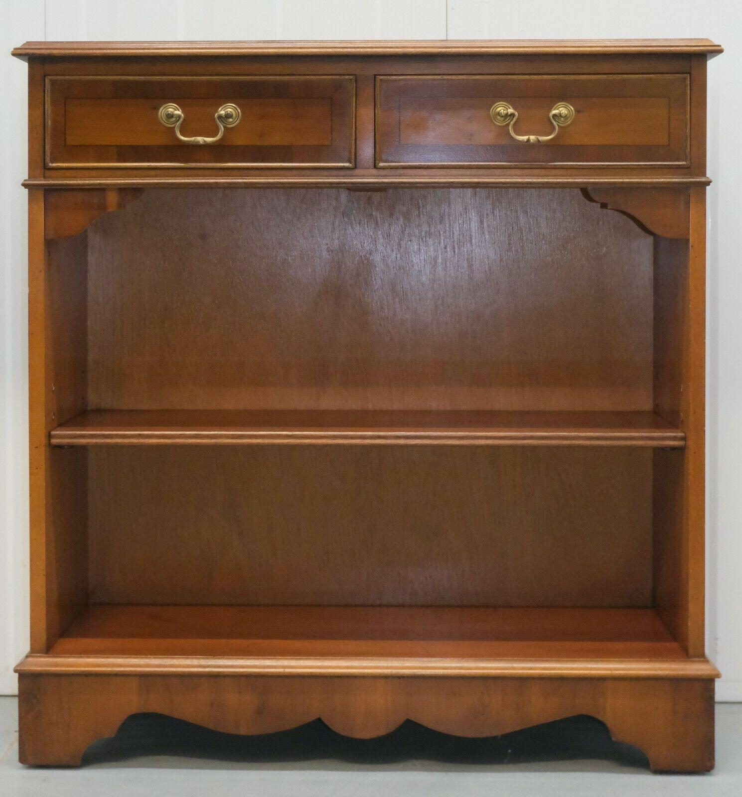 We are delighted to offer for sale this gorgeous Vintage yew wood dwarf open bookcase with twin drawers.

Its a well presented item, with drawers that run smoothly and height-adjustable shelf, giving you plenty of storage. Thanks to its size, they