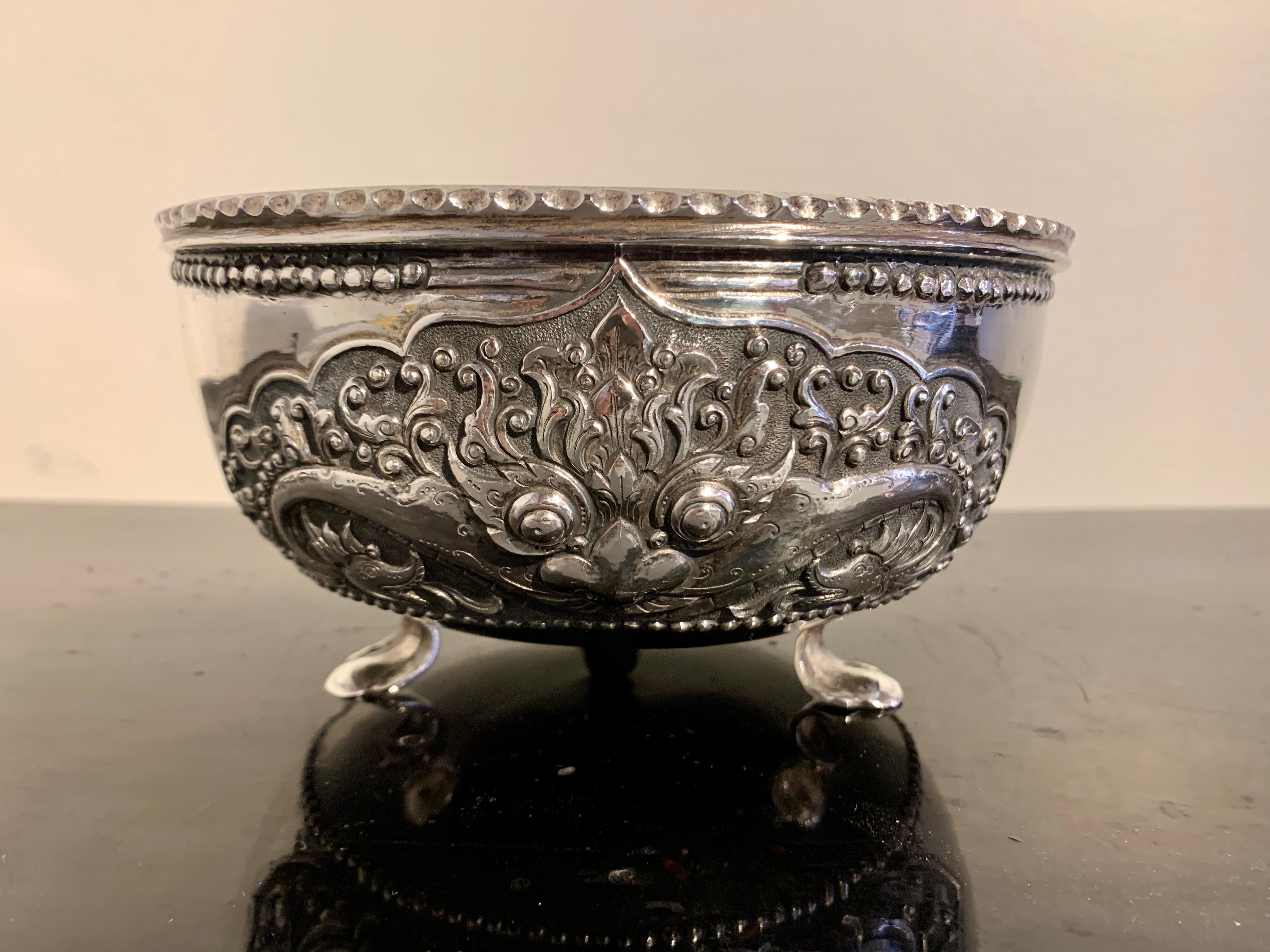 A bold and well crafted Indonesian Yogya (Jogja, Djokja) silver bowl by Tom's Silver, Yogyakarta, Java, Indonesia, circa 1960's. 

The elegant bowl features a striking design of a Kala face, a protective monster often found above temple doors, and