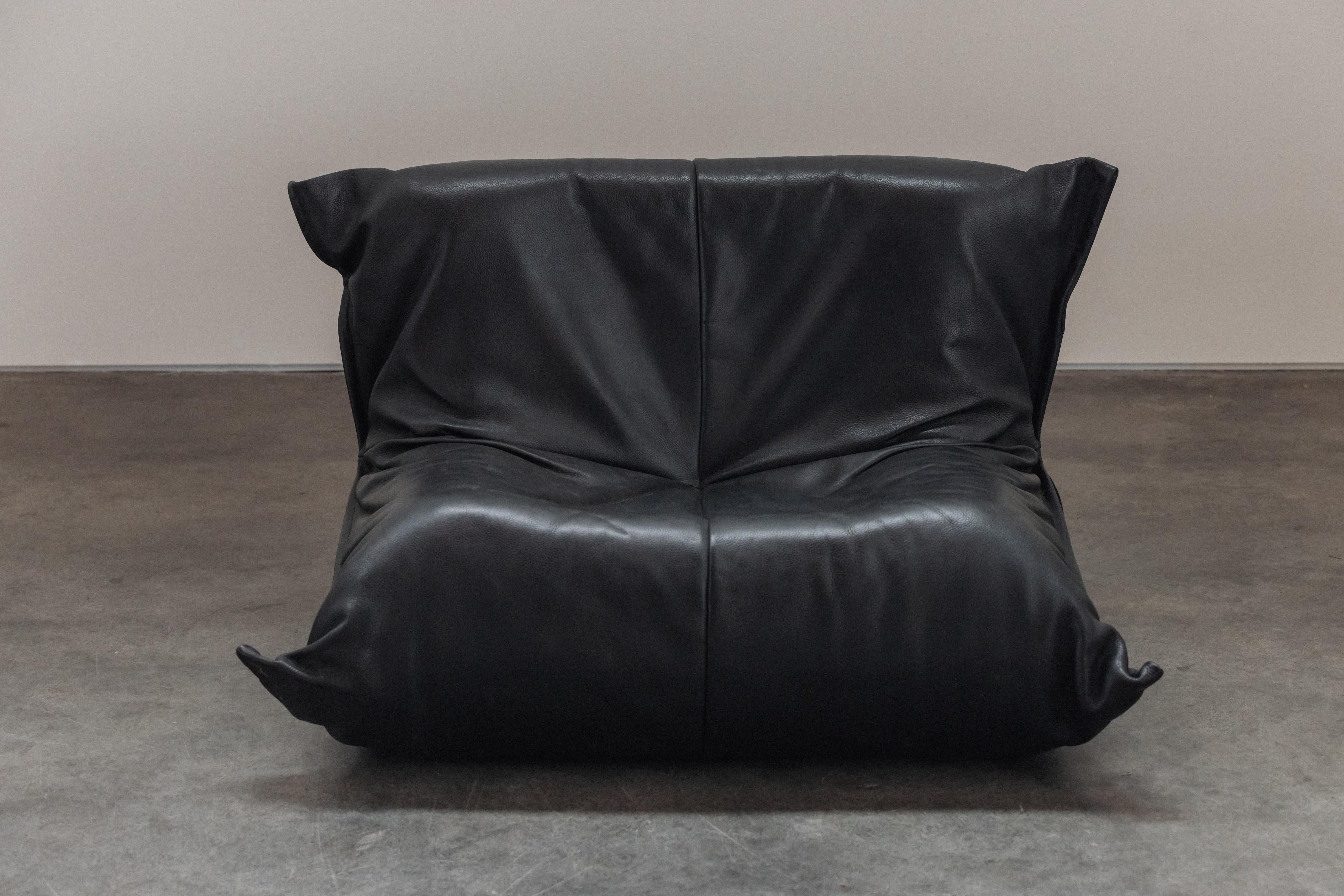 Vintage Yoko Lounge Chair By Ligne Roset From France, Circa 1970.  Original black leather upholstery with great patina and wear.