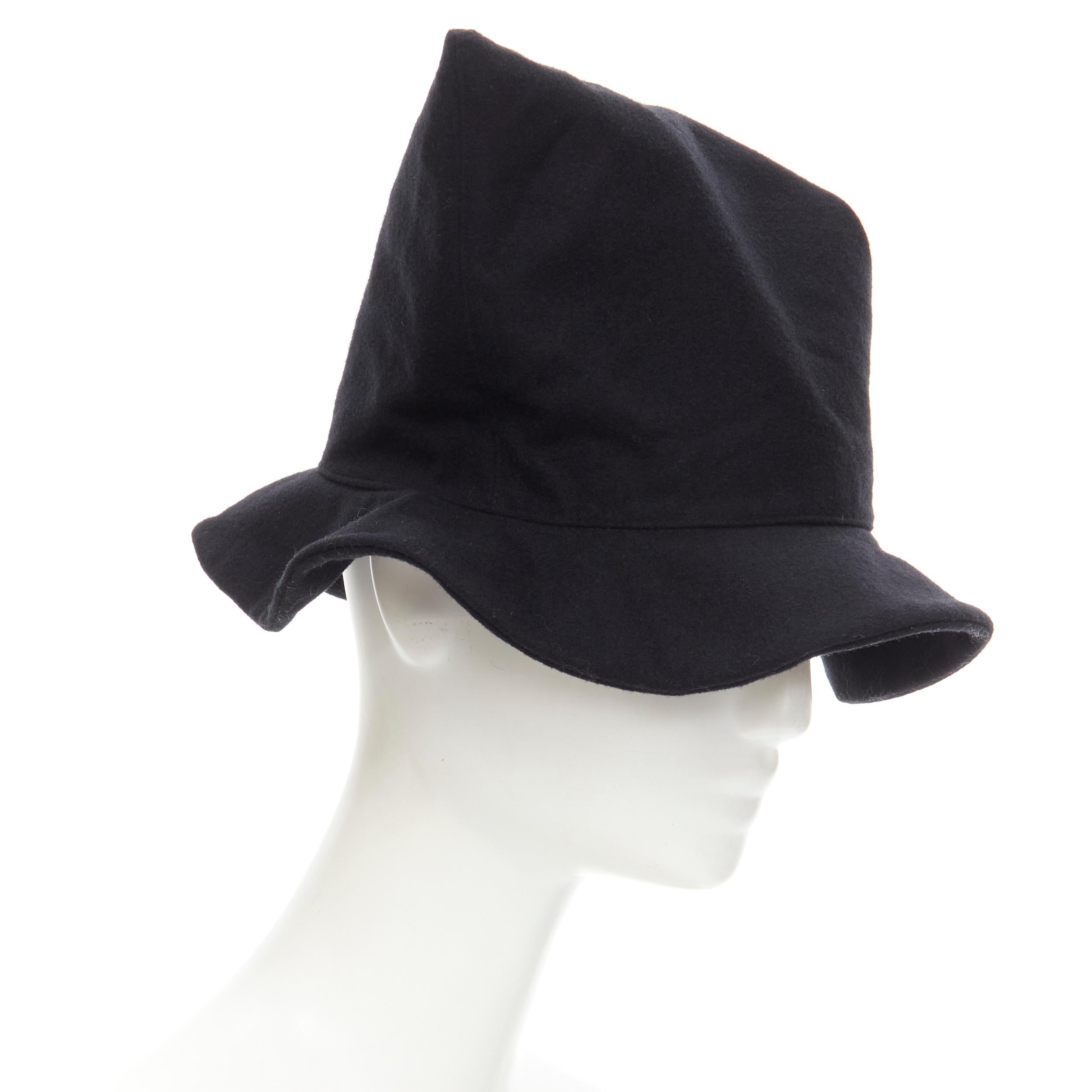 vintage Y's YOHJI YAMAMOTO black wool angular pointed witch Fedora hat 
Reference: CRTI/A00229 
Brand: Y's 
Designer: Yohji Yamamoto 
Material: Wool 
Color: Black 
Pattern: Solid 
Extra Detail: Triangular pinched at front. Pointed tip fedora hat.