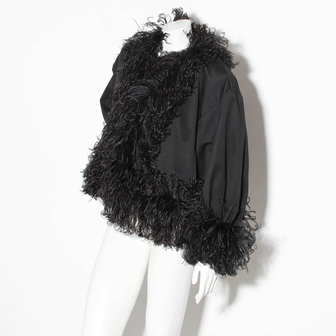 Product Details:
Vintage Feather Trim Jacket by Yves Saint Laurent (YSL)
Circa 1980's
Black cotton base
Ostrich feather trim
Dolman sleeves
Side Pockets
Padded shoulders
Made in France
Condition: Excellent vintage condition

Size/Measurements:
Size