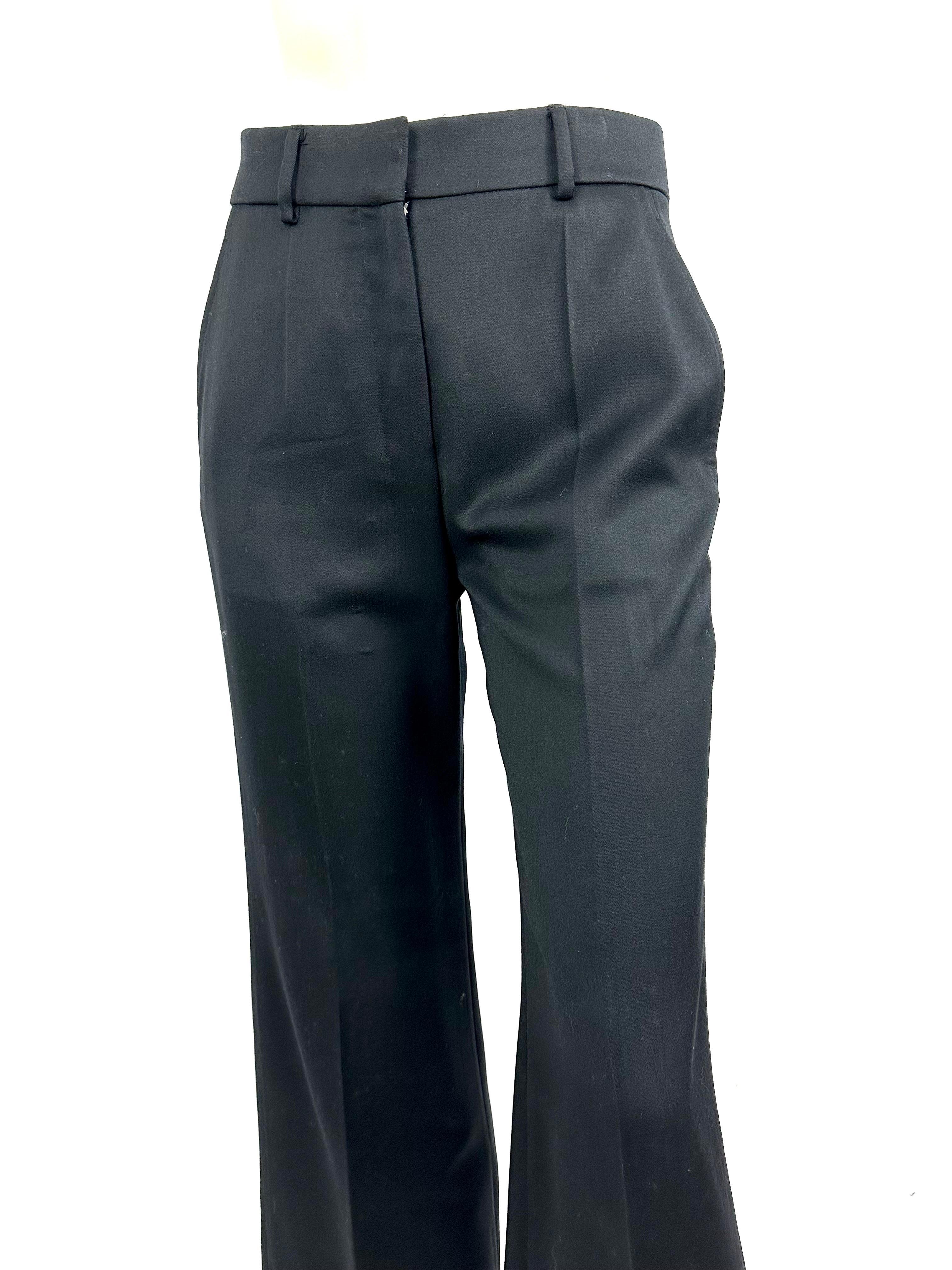 Vintage YSL pants by Tom Ford from the F/W 2003 collection.
in black wool, mid-high waist and slightly flared at the bottom.
2 patch pockets on the hips.
a pocket at the back of the pants.
zipper fly.
Size 38, refer to measurements
Waist 37cm, 
hips