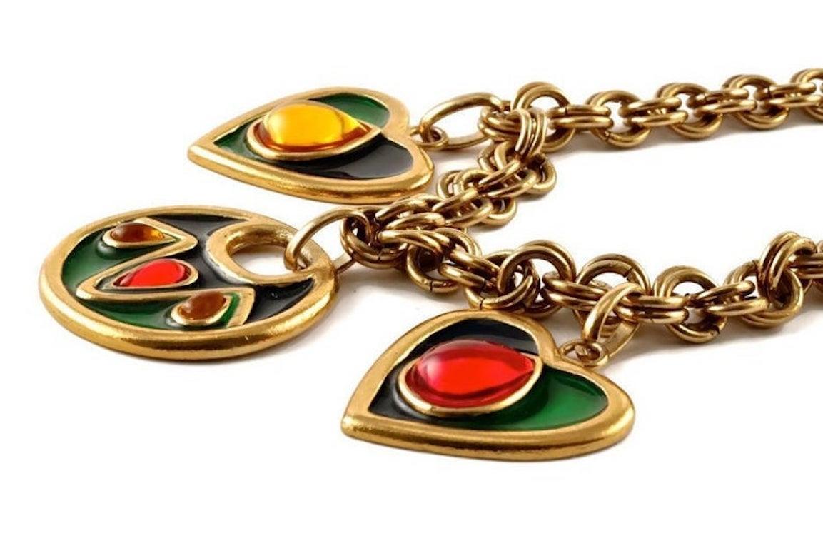 Vintage YSL Yves Saint Laurent by Robert Goossens Enamel Heart Round Charm Cabochon Necklace

Measurements:
Round Charm: 1 5/8 inches (4.12 cm)
Heart Chart: 1 4/8 inches (3.81 cm)
Wearable Length: 16 2/8 inches (41.27 cm)

Features:
- 100% Authentic