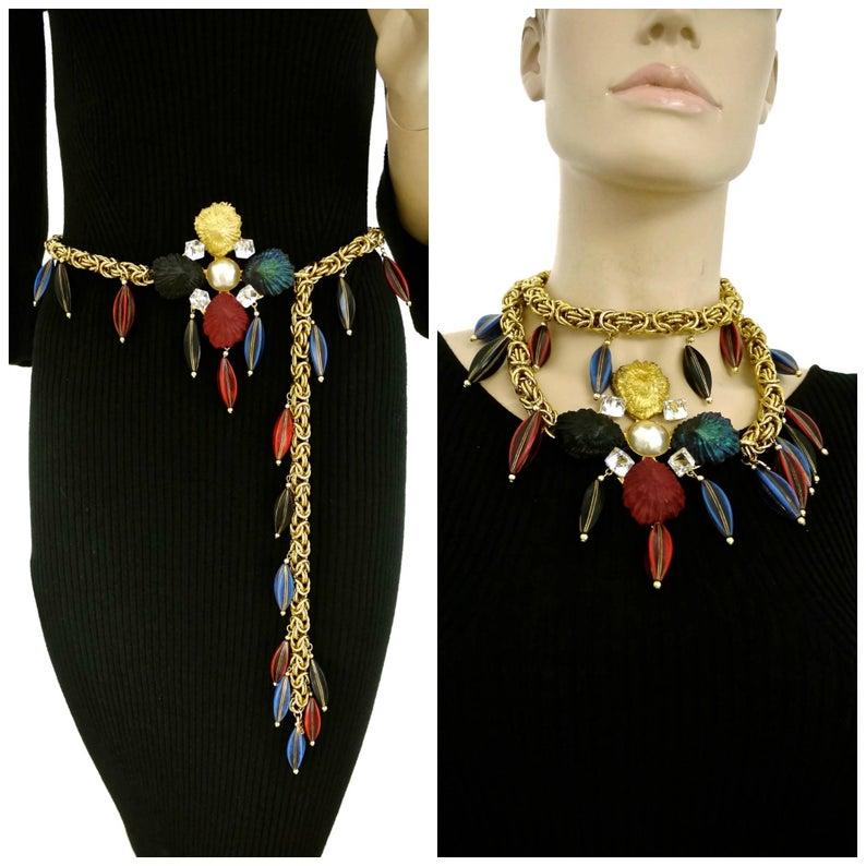 Vintage YSL Yves Saint Laurent by Robert Goossens Shell Flower Wooden Charm Necklace Belt

Measurements:
Height: 3.75 inches (9.6 cm)
Charms: 1.6 inches (4 cm)
Length: 39.37 inches (100 cm) end to end
