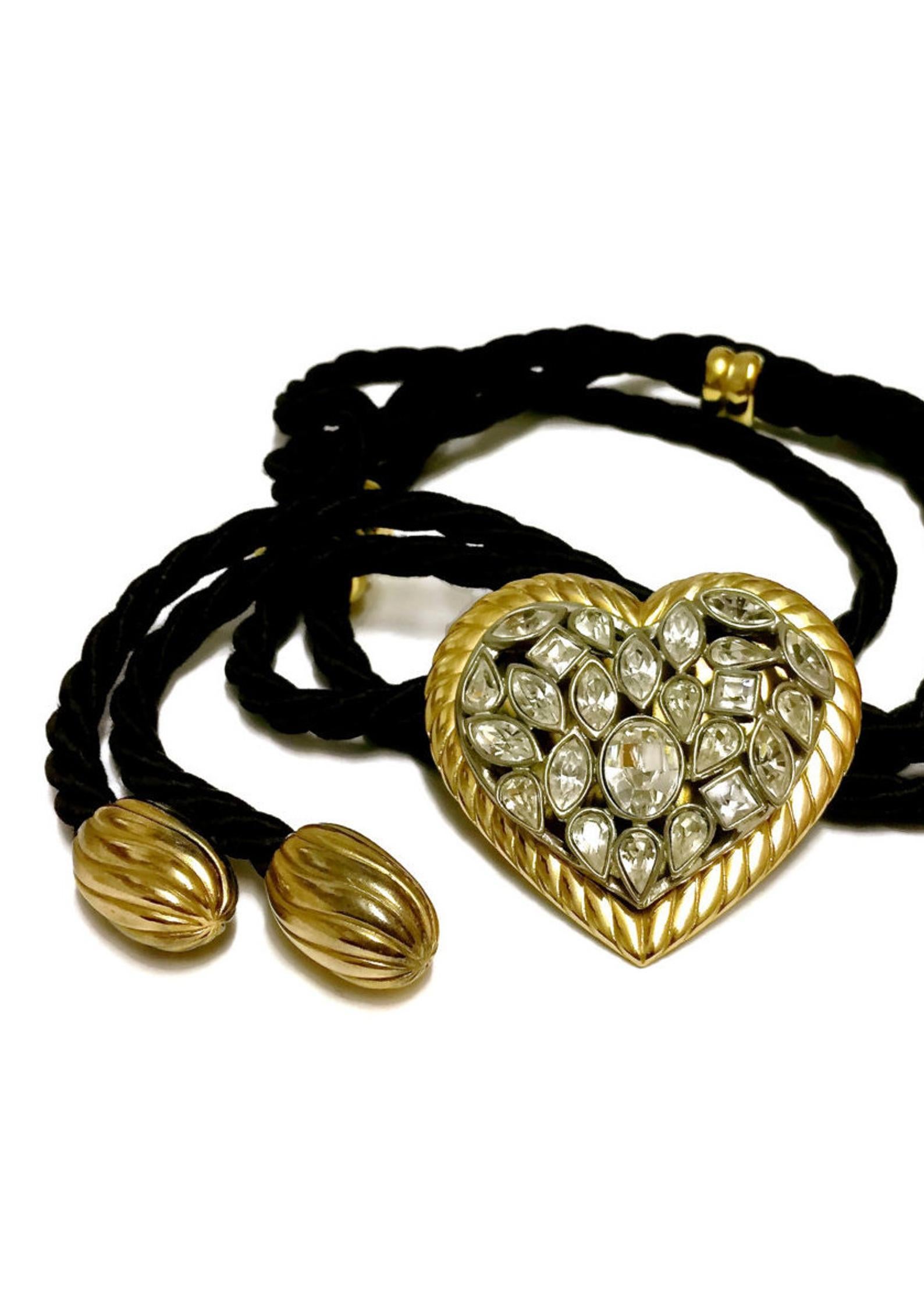 Vintage YSL Yves Saint Laurent by Robert Goossens Heart Stone Cord Necklace Belt

Measurements:
Height: 2 4/8 inches (6.35 cm)
Width: 2 4/8 inches (6.35 cm)
Length: 38 inches (96.52 cm)

Features:
- 100% Authentic YVES SAINT LAURENT by Robert