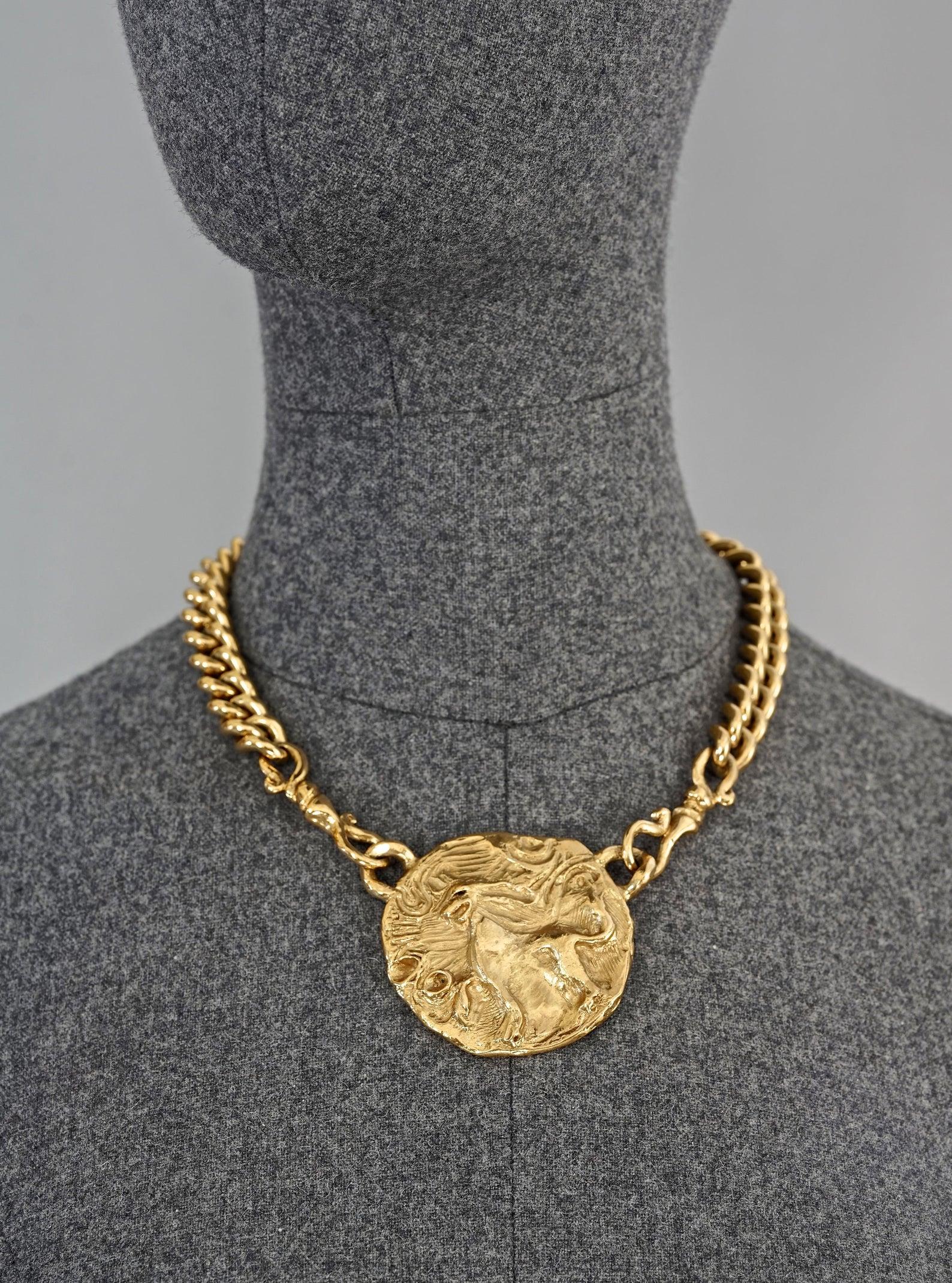 Vintage YSL Yves Saint Laurent by Robert Goossens Lion Medallion Necklace

Measurements:
Lion Medallion: 2 1/8 inches (5.39 cm)
Wearable Length: 15 inches 38.10 cm) to 17.5 inches (44.45 cm)

Features:
- 100% Authentic YVES SAINT LAURENT by Robert