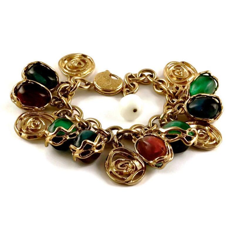 Vintage YSL Yves Saint Laurent by Robert Goossens Spiral Disc Multicolor Cabochon Charm Bracelet

Measurements:
Height: 1 5/8 inches (4.12 cm)
Width: 6 4/8 inches (16.51 cm) to 8 4/8 inches (21.59 cm)

- 100% Authentic YVES SAINT LAURENT by Robert