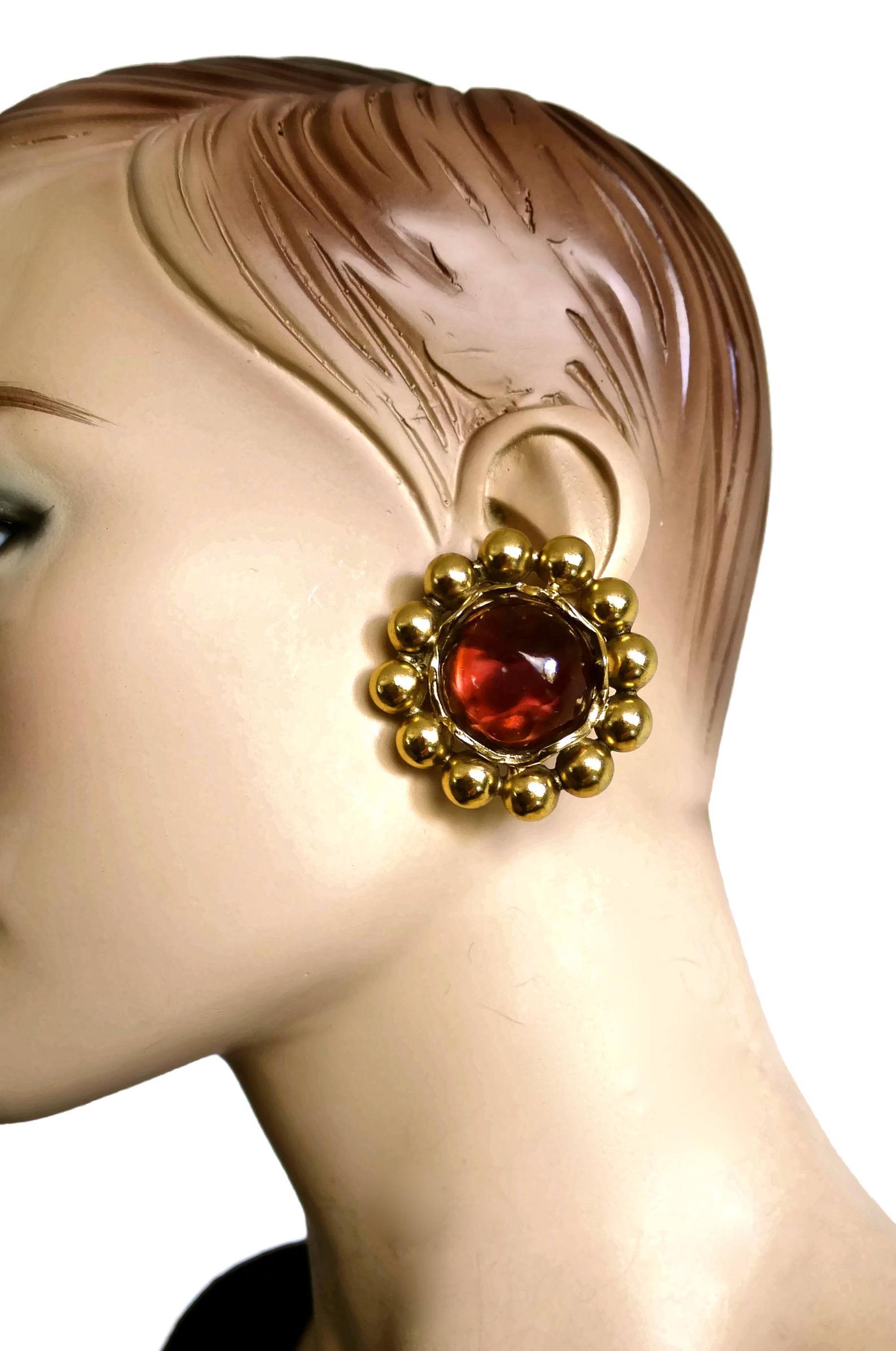 Vintage YSL Yves Saint Laurent Dark Amber Resin Poured Flower Earrings

Measurements:
Height: 1.85 inches (4.7 cm)
Width: 1.85 inches (4.7 cm)
Depth: 0.43 inch (1.1 cm)
Weight: 27 grams

Features:
- 100% Authentic YVES SAINT LAURENT.
- Flower