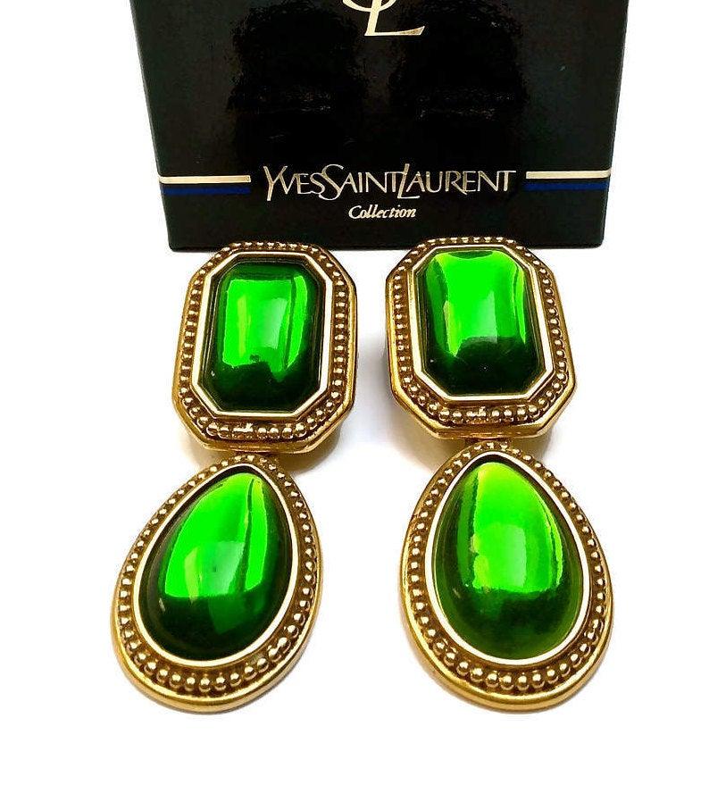Vintage YSL Yves Saint Laurent Emerald Byzantine Drop Earrings

Measurements:
Height: 3 inches (7.62 cm)
Width: 1 1/8 inches (2.85 cm)

Features:
- 100% Authentic YVES SAINT LAURENT.
- Green resin embellishment.
- Byzantine style.
- 2 in 1 earrings