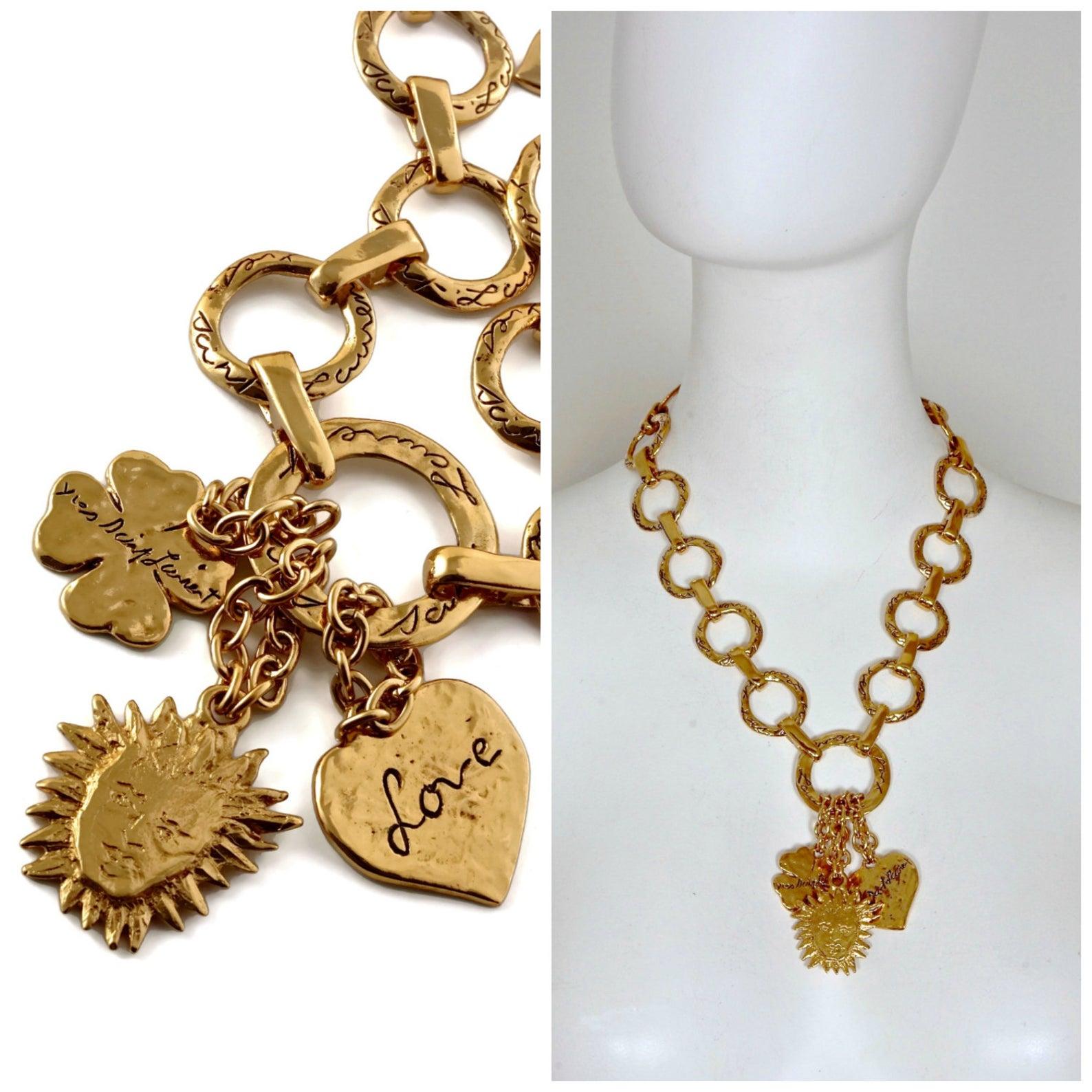 Vintage YSL Yves Saint Laurent Love by Robert Goossens Sun Clover Heart Charm Necklace

Measurements:
Height: 3 5/8 inches (9.20 cm)
Wearable Length: 18 2/8 inches (46.35 cm) to 20 2/8 inches (51.45 cm)

Features:
- 100% Authentic YVES SAINT LAURENT