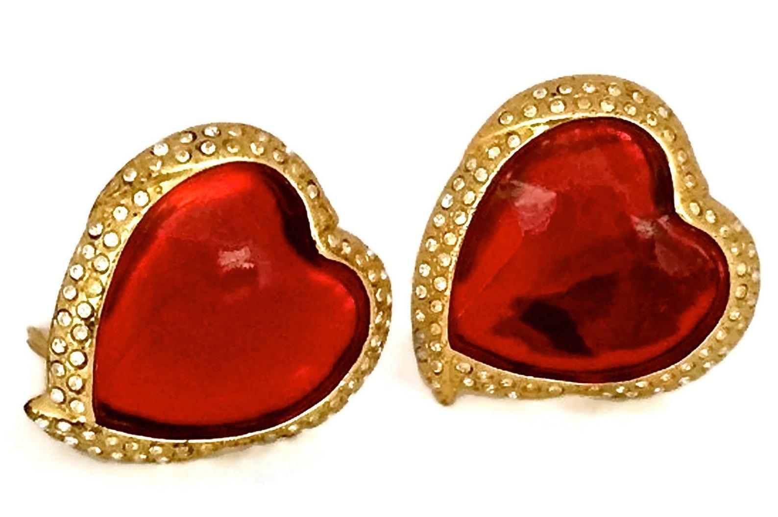 Vintage YSL Yves Saint Laurent Red Faceted Heart Rhinestone Earrings

Measurements:
Height: 1.5 inches (3.81 cm)
Width: 1.3 inches (3.4 cm)

Features:
- 100% Authentic Yves Saint Laurent.
- Raised faceted red heart surrounded with rhinestones.
-