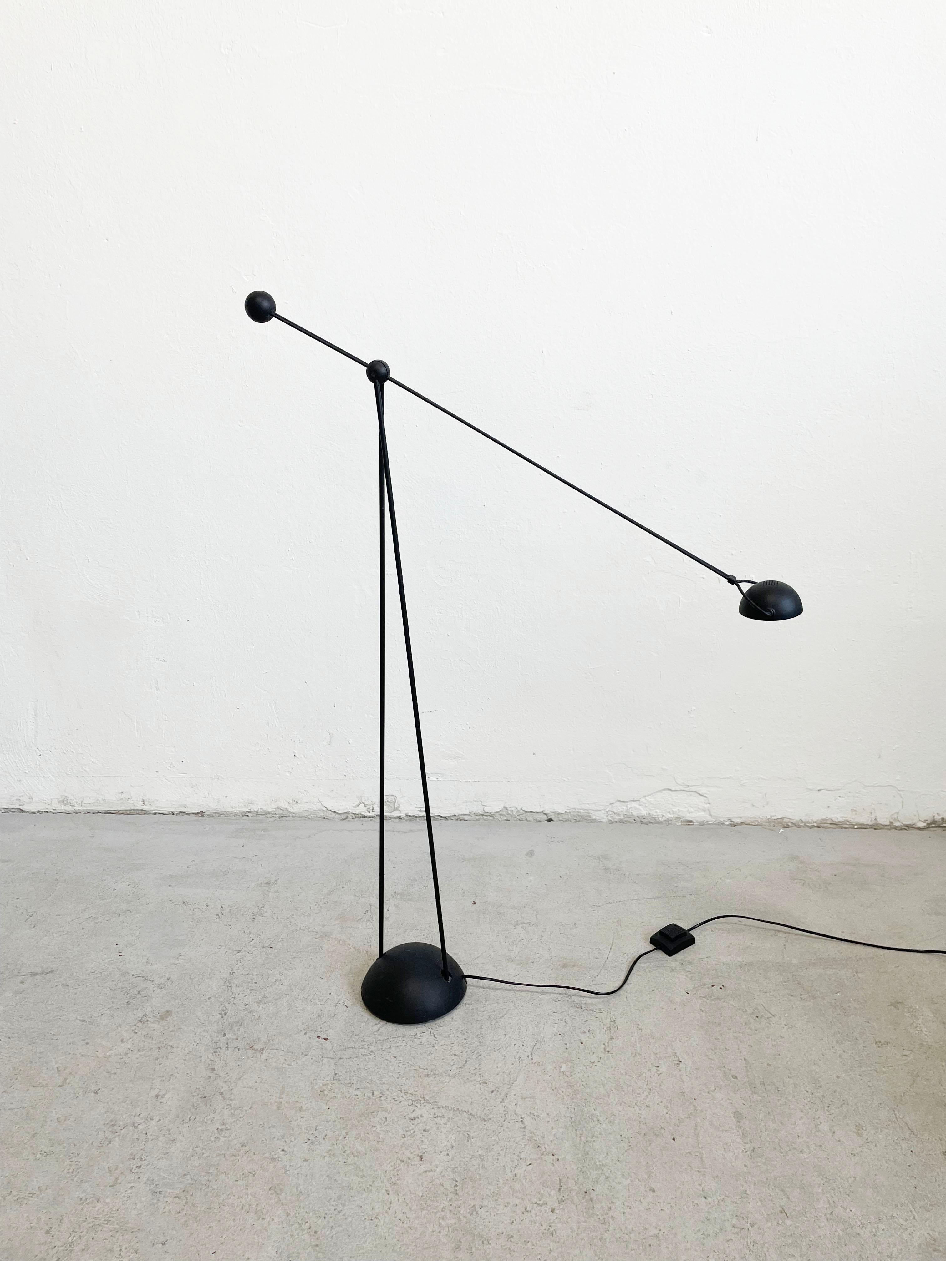 Vintage post modern halogen floor lamp model Yuki produced in the 1980s by Stefano Cevoli.
Design by Paolo Francesco Piva.

Heavy hemispherical base in black painted metal on the bottom side has a producer's stamp.
Double stem in black painted metal