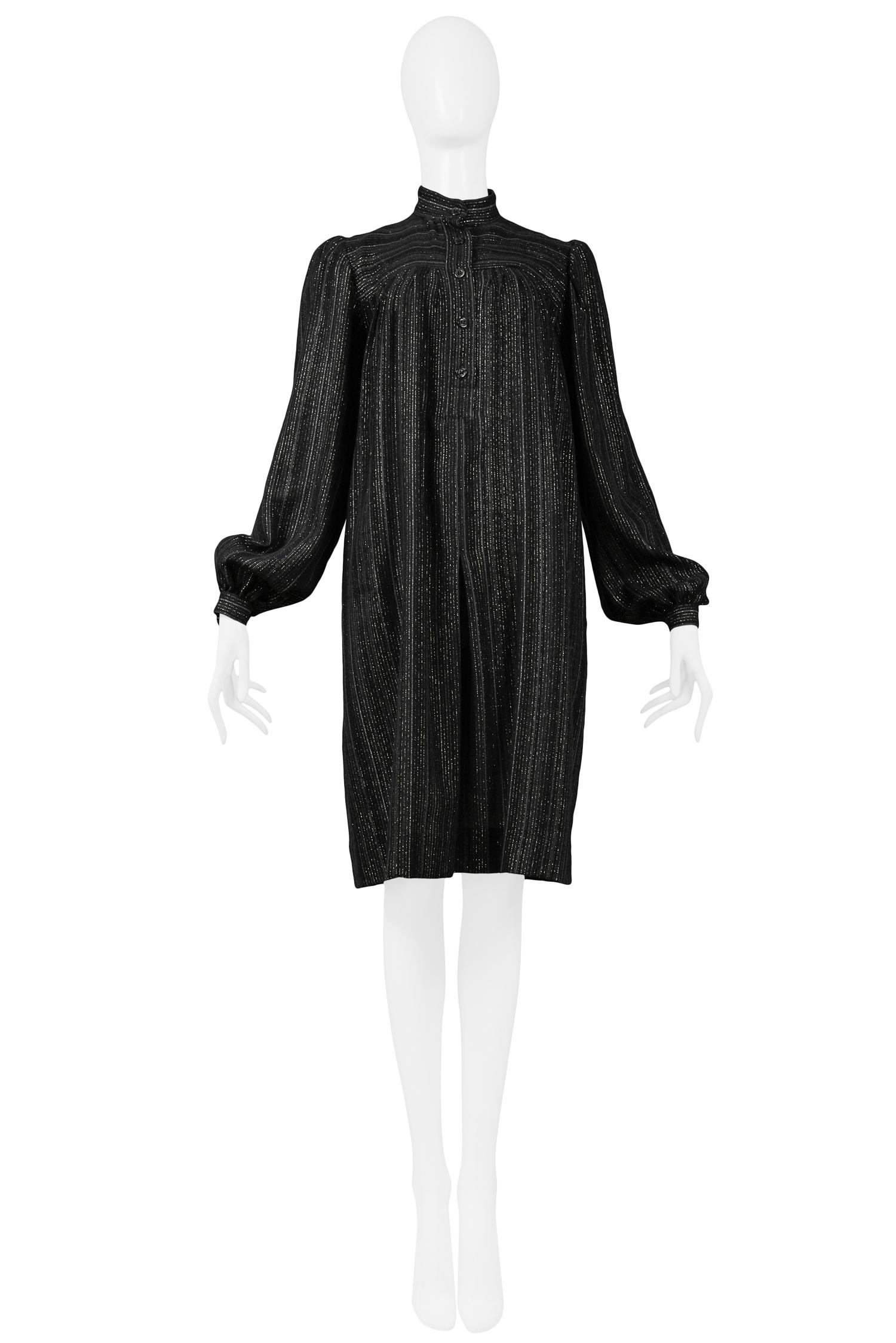 Vintage Yves Saint Laurent black wool peasant style smock dress featuring gold lurex stripes, high neck, long sleeves and button front detail. 

Size: 40

Excellent Condition. 