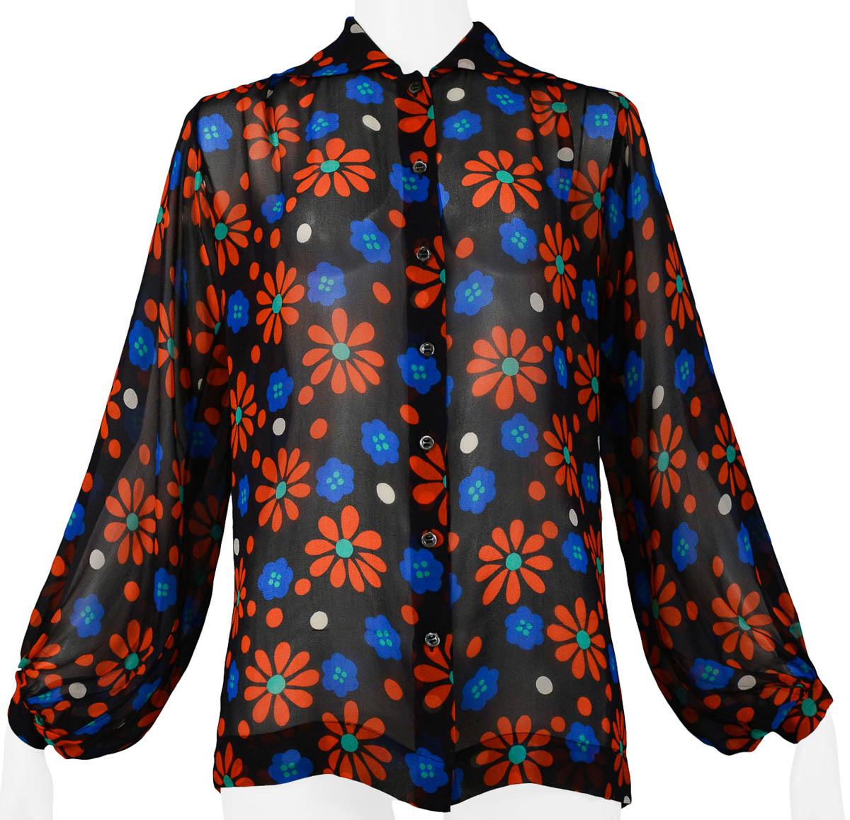 Vintage Yves Saint Laurent red & blue silk floral and white dot print blouse featuring a round neck with spread collar and long sleeves with button cuffs.

Excellent Condition.

Size: 38 