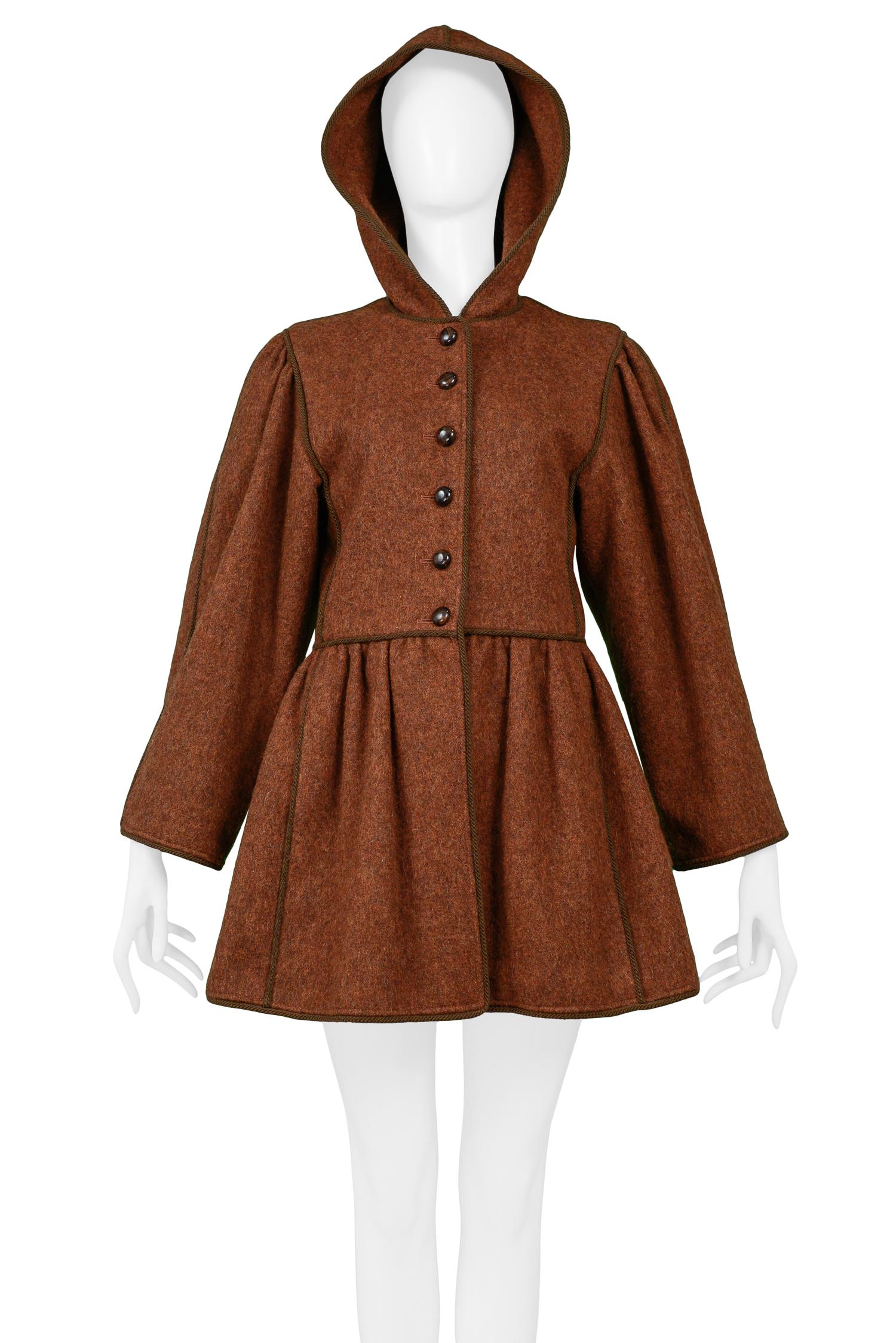 Vintage Yves Saint Laurent brown wool hooded coat from the Russian Collection featuring front button closure and tonal braided trim. Circa 1976-77.'

Size: 36

Excellent Condition. 