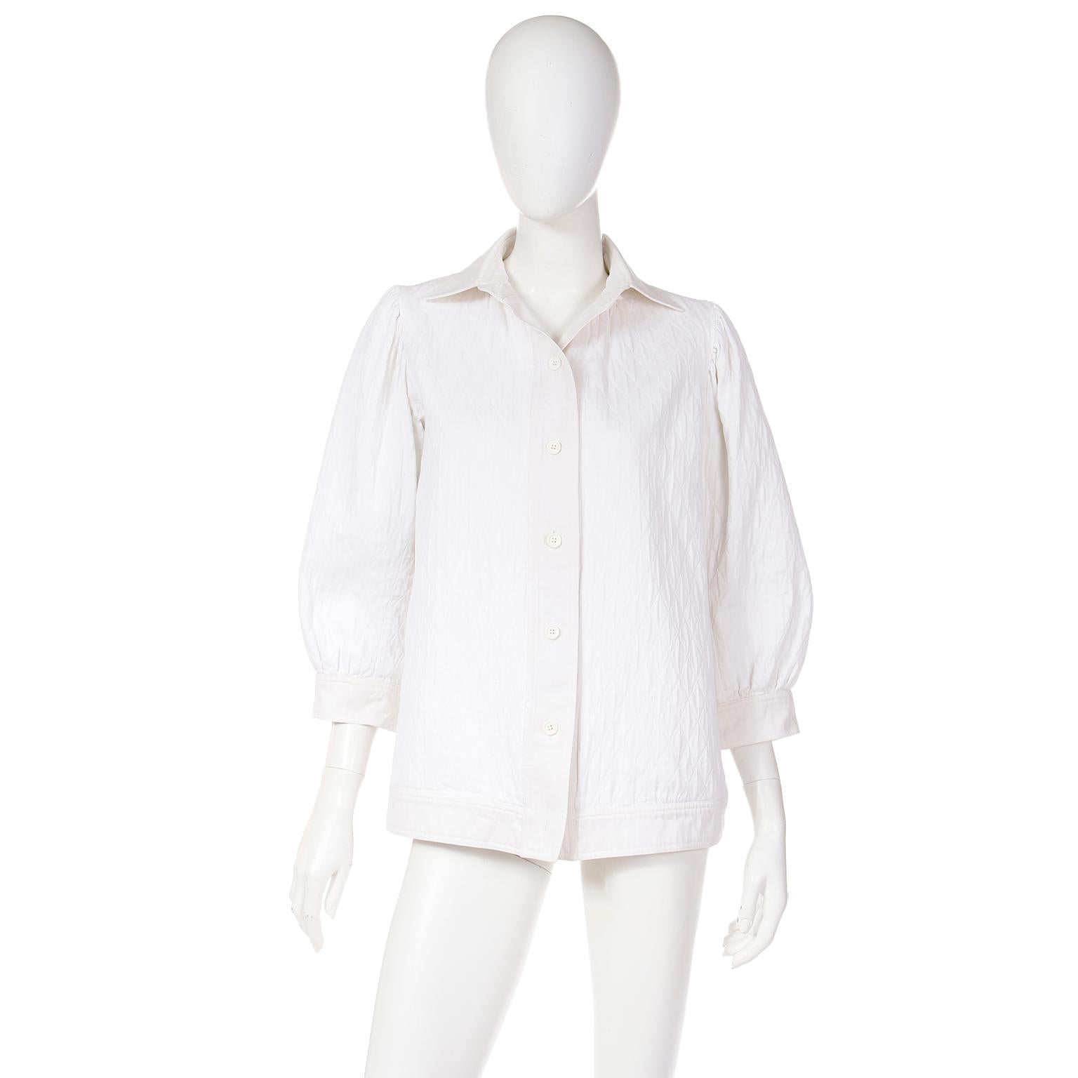 This is a rare 1970's Yves Saint Laurent Rive Gauche ivory quilted textured collared jacket. This jacket is in Yves Saint Laurent's signature smock style (without the usual patch pockets) and it would be a great addition to any wardrobe. You can