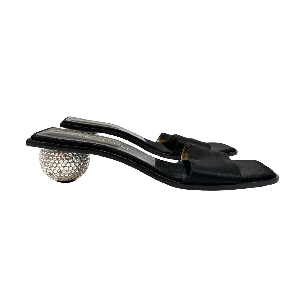 Ball heel sandals by Yves Saint Laurent
Circa 1990's
Made in Italy 
Black satin toe strap 
Black leather insole 
Ball heel covered in crystals 
Wooden sole   
Great vintage condition: some wear on soles, a few missing crystals on each heel (see