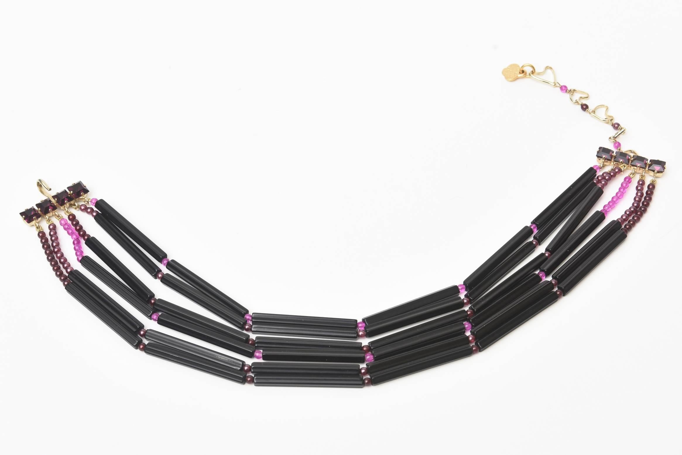This rare, ultra chic and vintage hallmarked Yves Saint Laurent 6 strand necklace is purple and black glass. This is a very special necklace of the french fashion master. It is hallmarked 