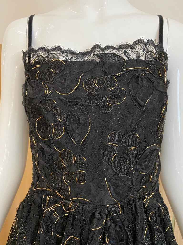 Elegant vintage Yves saint laurent rive gauche black lace with gold lace thread with spaghetti strap 
Bust: 30inches/ Waist: 24 inches 
size 2/Small