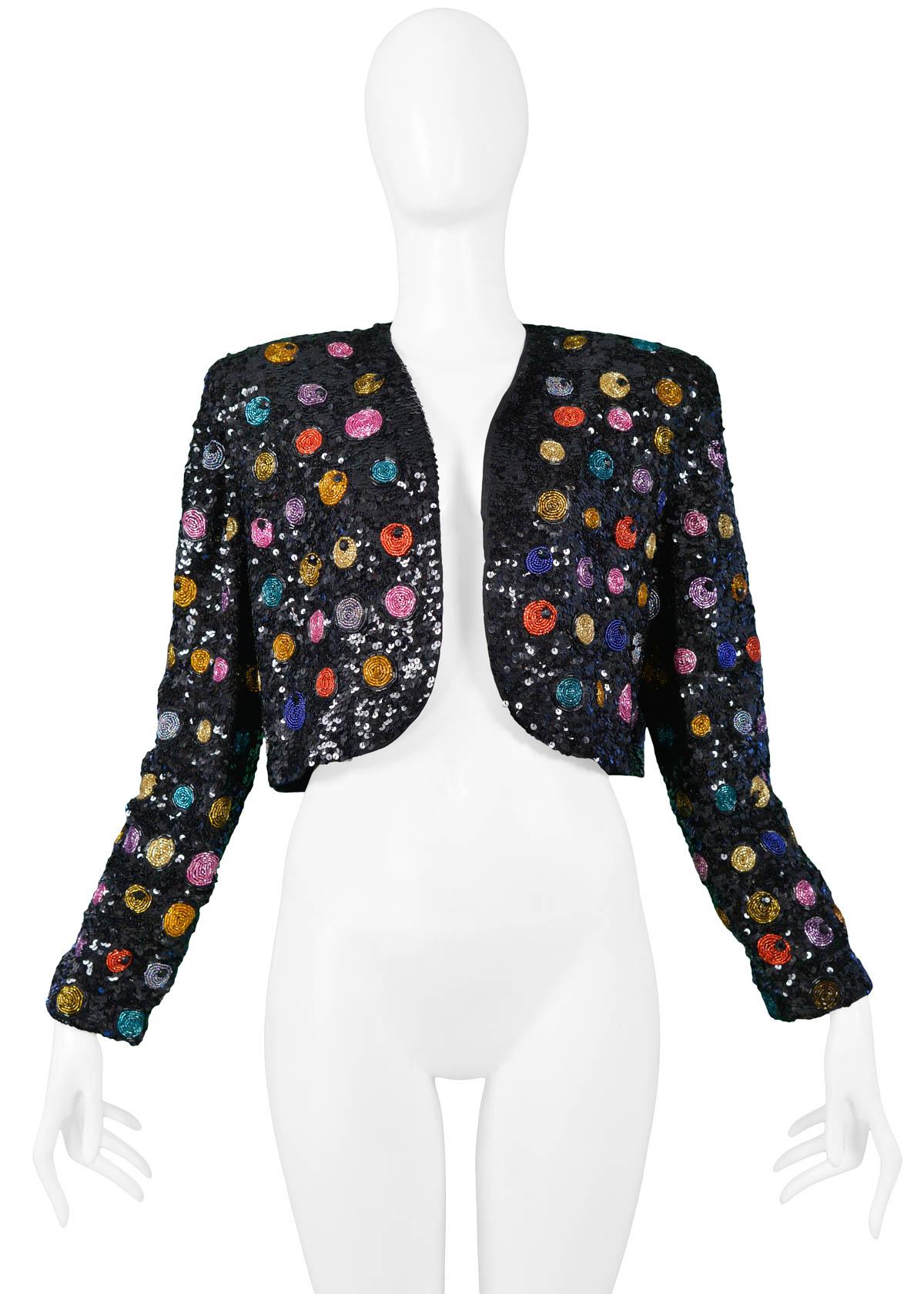 Vintage black Yves Saint Laurent sequin bolero jacket featuring multicolor circular beaded applique, long sleeves, and structured shoulders.

Excellent Vintage Condition.

No Size Label. 
Will fit a size Small. Please inquire for measurements.