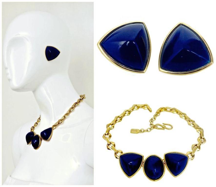 Vintage Yves Saint Laurent Blue Chunky Geometric Earrings Necklace Set

Measurements:
EARRINGS
Height: 1 4/8 inches
Width: 1 4/8 inches
Depth: 7/8 inch

NECKLACE
Centerpiece: 4 inches X 1 4/8 inches
Overall Length: 19 inches

Features:
- 100%