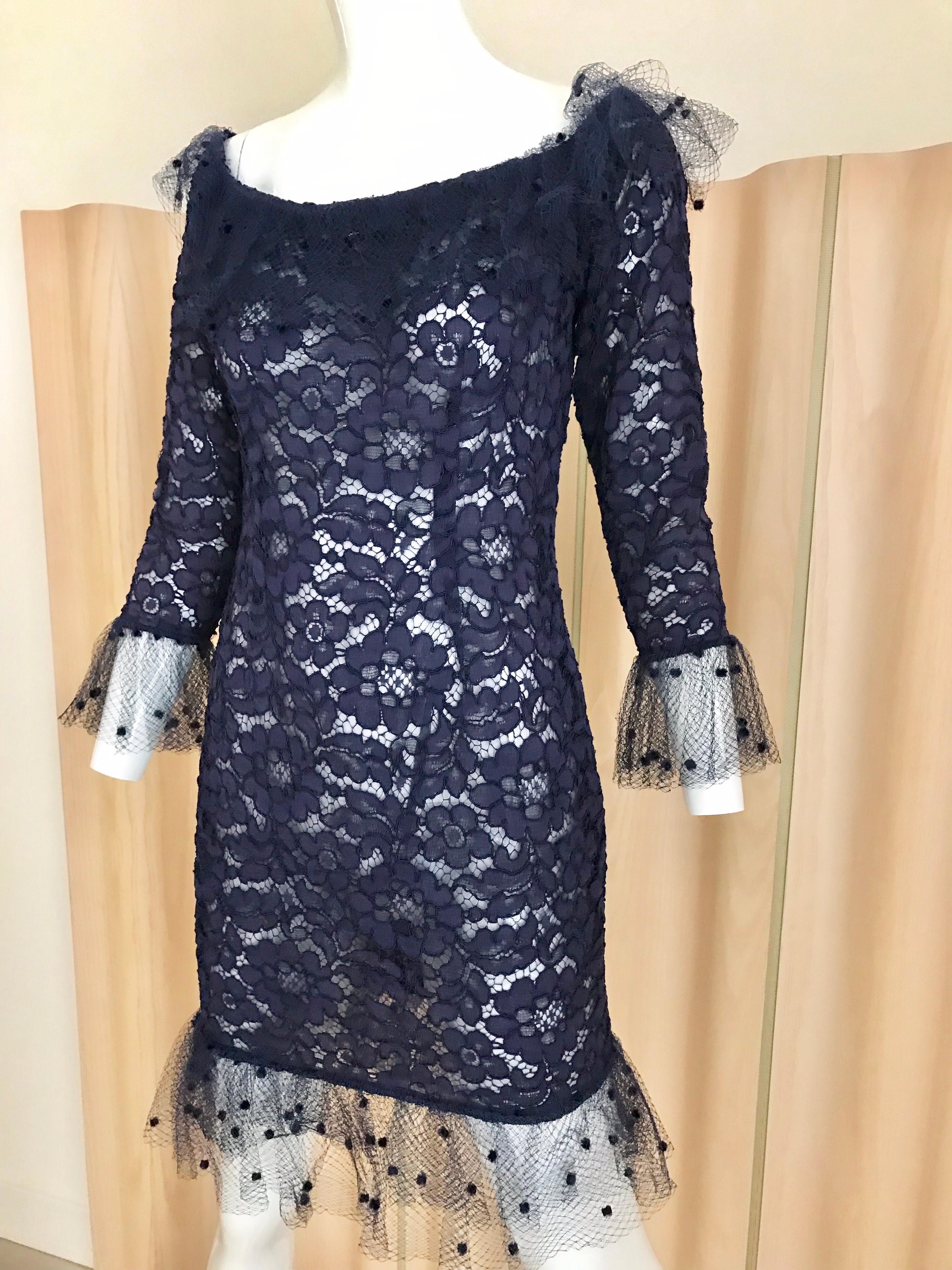 Chic Vintage Yves Saint Laurent Blue Lace sheath cocktail dress with delicate tulle netting lace on collar and sleeves. Perfect cocktail dress.
Size: 4