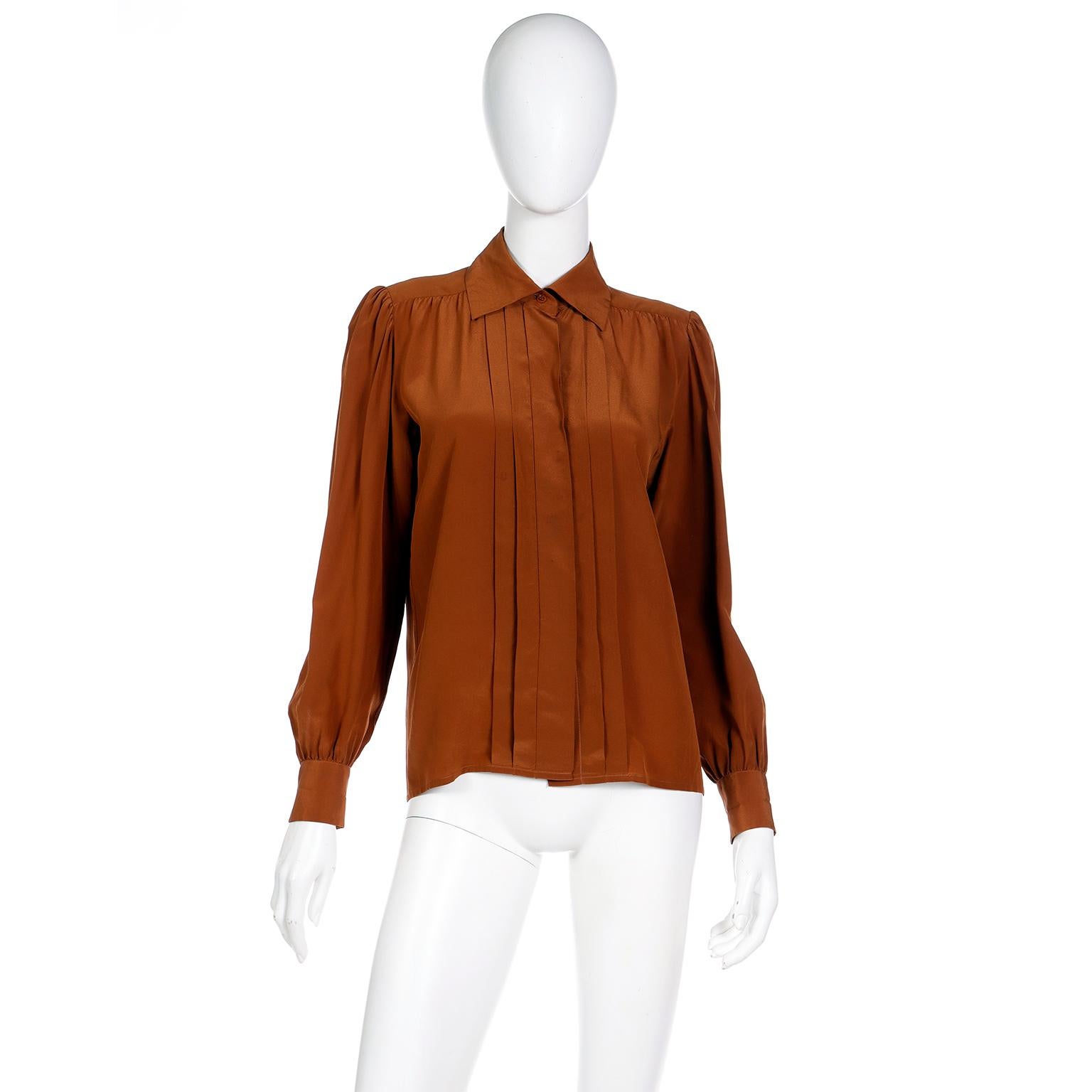 There is nothing quite like a vintage Yves Saint Laurent blouse! We have sold hundreds of them and they never disappoint! This luxe brown silk YSL blouse was made In France in the late 1970's and is in a rich coffee brown hue. We love the delicate