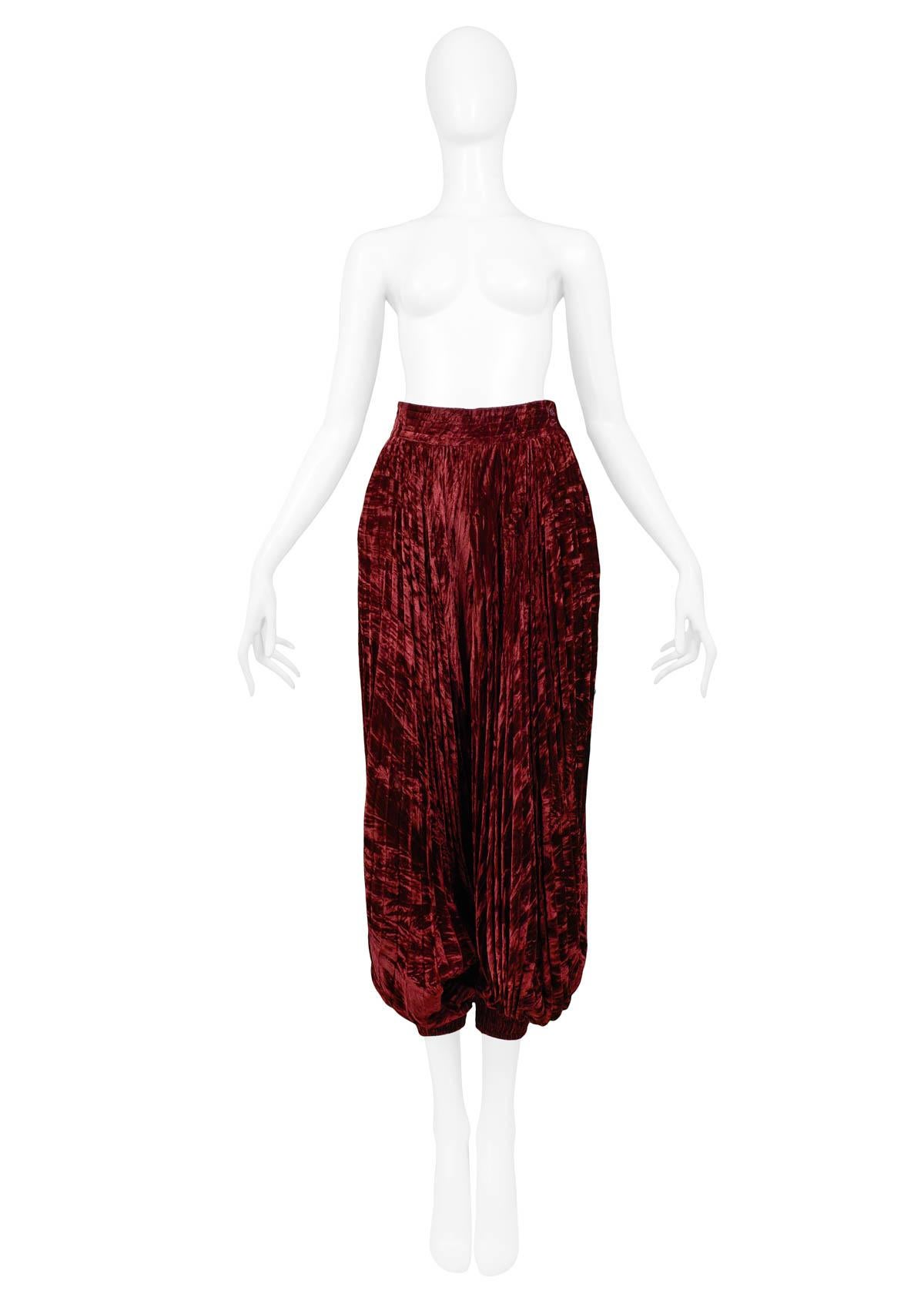 Resurrection Vintage is excited to offer a vintage burgundy YSL velvet harem pants with pleated balloon-style legs and elastic cuffs, a high waistband, and an invisible side zipper.

Yves Saint Laurent
Size 34
Velvet
Excellent Vintage