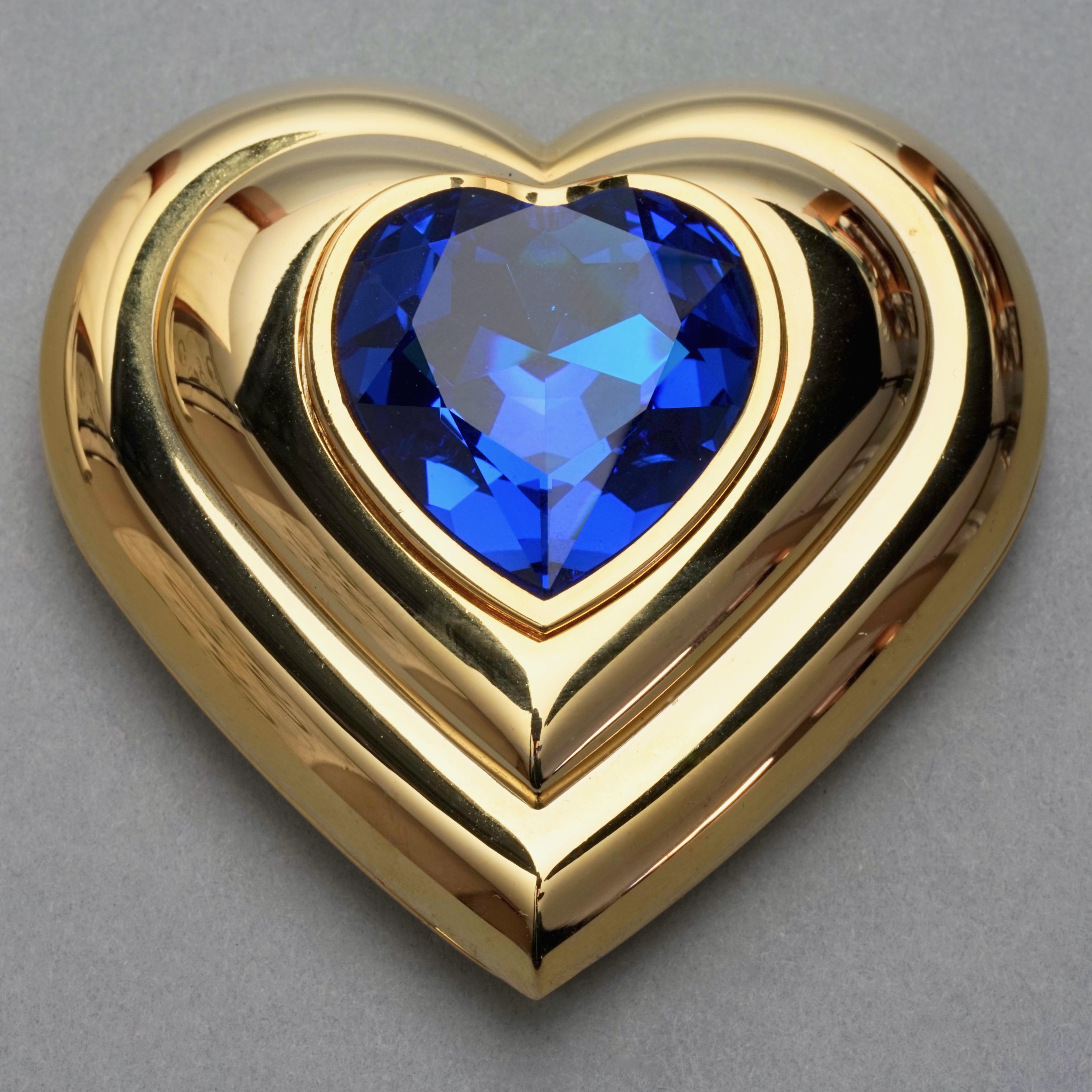 Vintage YVES SAINT LAURENT by Robert Goossens Blue Heart Jewelled Compact Powder

Measurements:
Height: 2.63 inches (6.7 cm)
Width: 2.63 inches (6.7 cm)

Features:
- 100% Authentic YVES SAINT LAURENT by Robert Goossens.
- Heart blue rhinestone