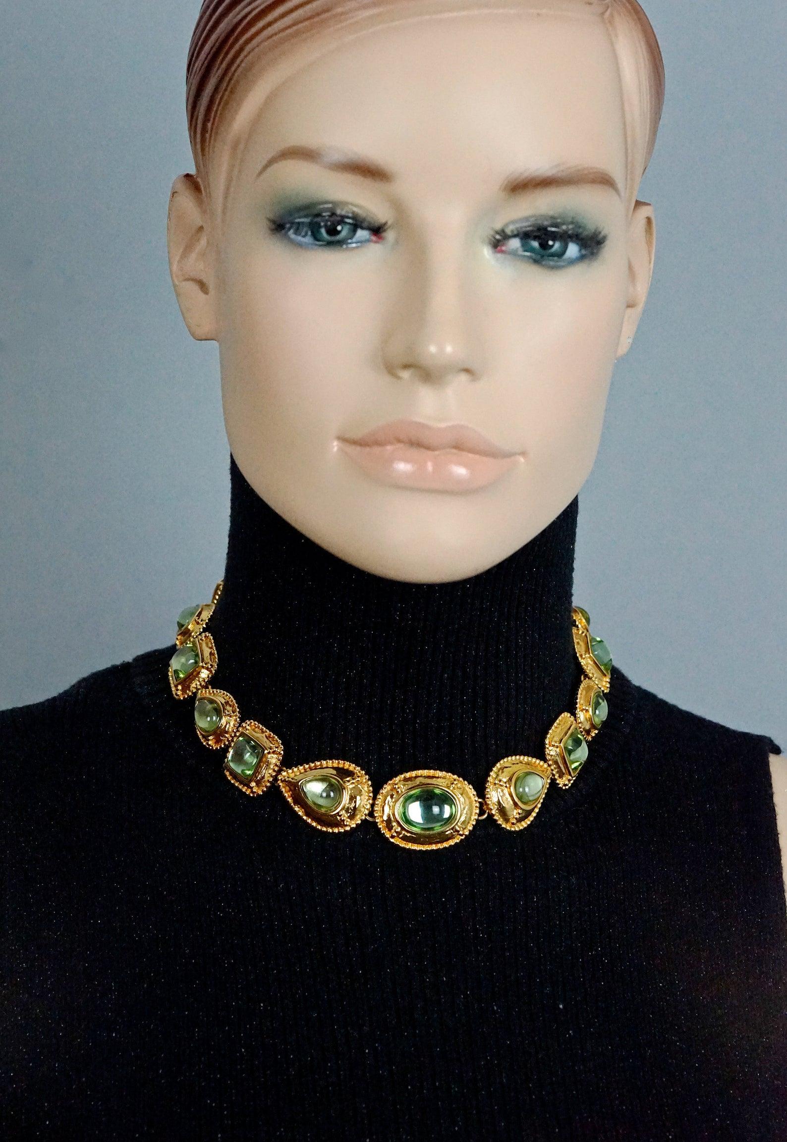 Vintage YVES SAINT LAURENT Cabochon Geometric Necklace by Robert Goossens

Measurements:
Height: 1 inch
Wearable Length: 14 inches to 16 4/8 inches

Features:
- 100% Authentic YVES SAINT LAURENT.
- Oval, pear and square textured links.
- Aqua marine
