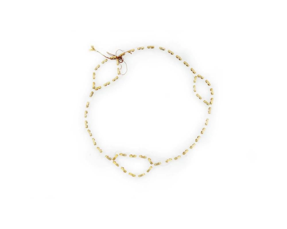 A vintage chain belt or necklace by Yves Saint Laurent. Ca. 1970s. Gold-tone and transparent lucite disc-shaped links. YSL logo charm is attached to one of the links. Hook clasp. Collectible Luxury Accessories And Jewelry.

Dimensions: L 42 in. All