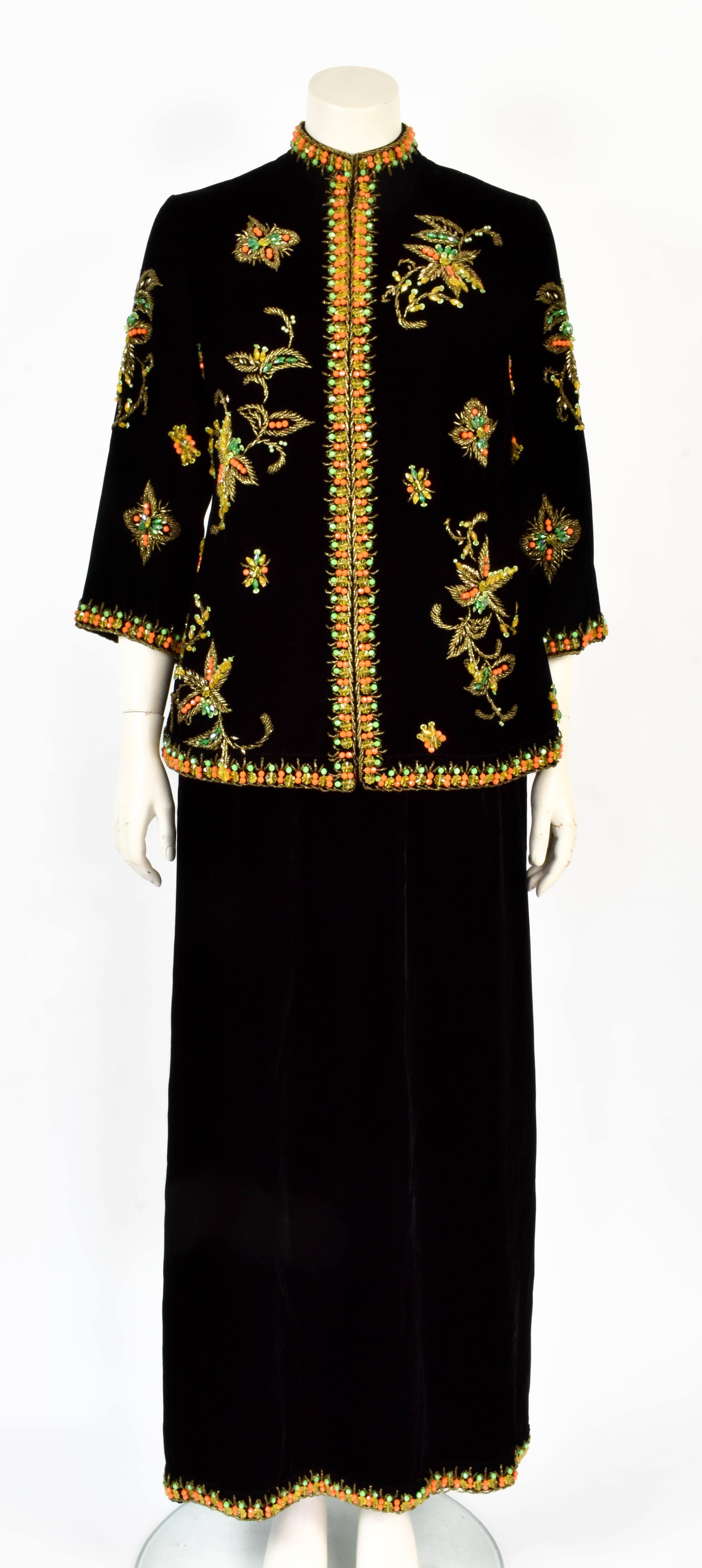 This Yves Saint Laurent ensemble consists of a skirt and a jacket. It is made from soft velvet and has exquisite beading attributed to Maison Lesage. A very rare and stunning piece. 

Size: XS or S

Jacket
Shoulder to Shoulder 40 cm /  15.8