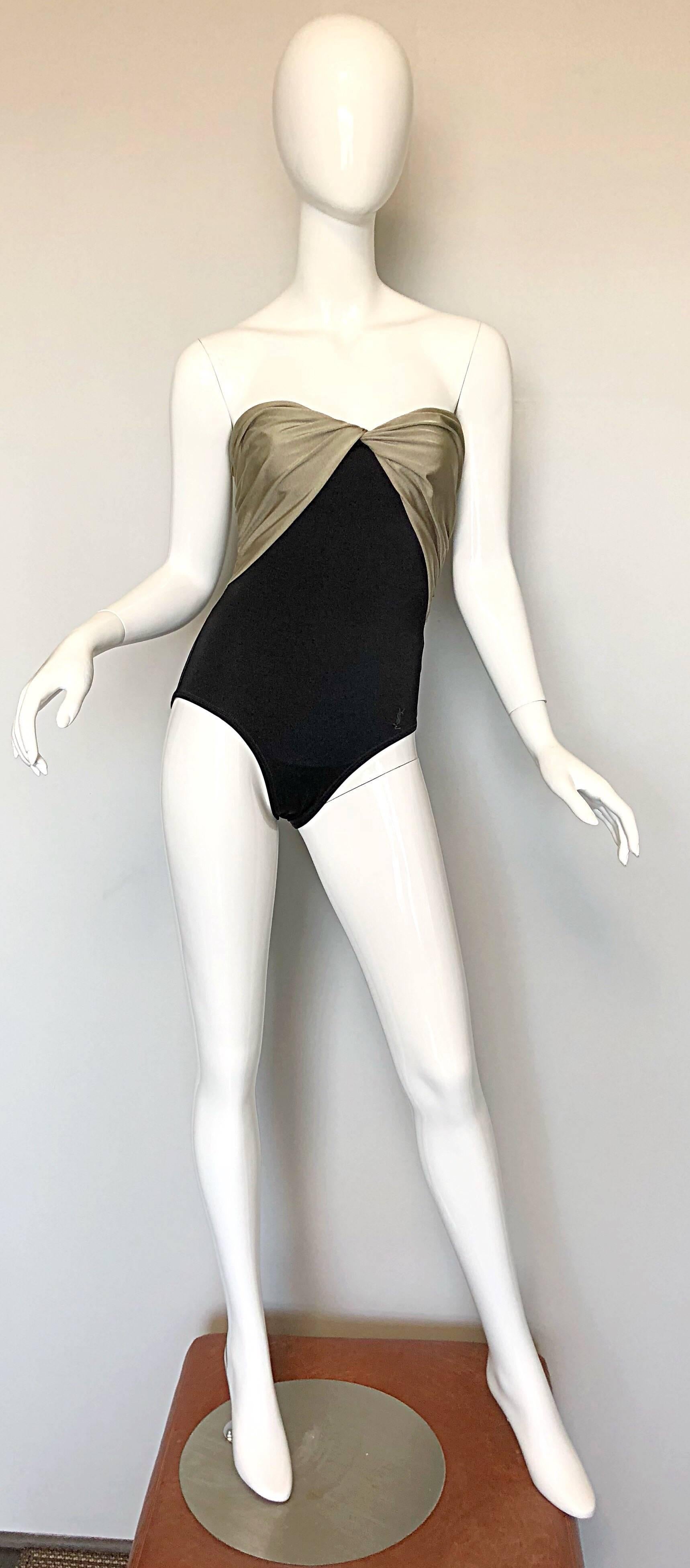 Sexy vintage 80s Yves Saint Laurent YSL black and muted gold color block strapless swimsuit or bodysuit! Features a flattering sweetheart neck design, with a bust and body that stretches to fit. YSL logo embroidered at left front hip. Classic