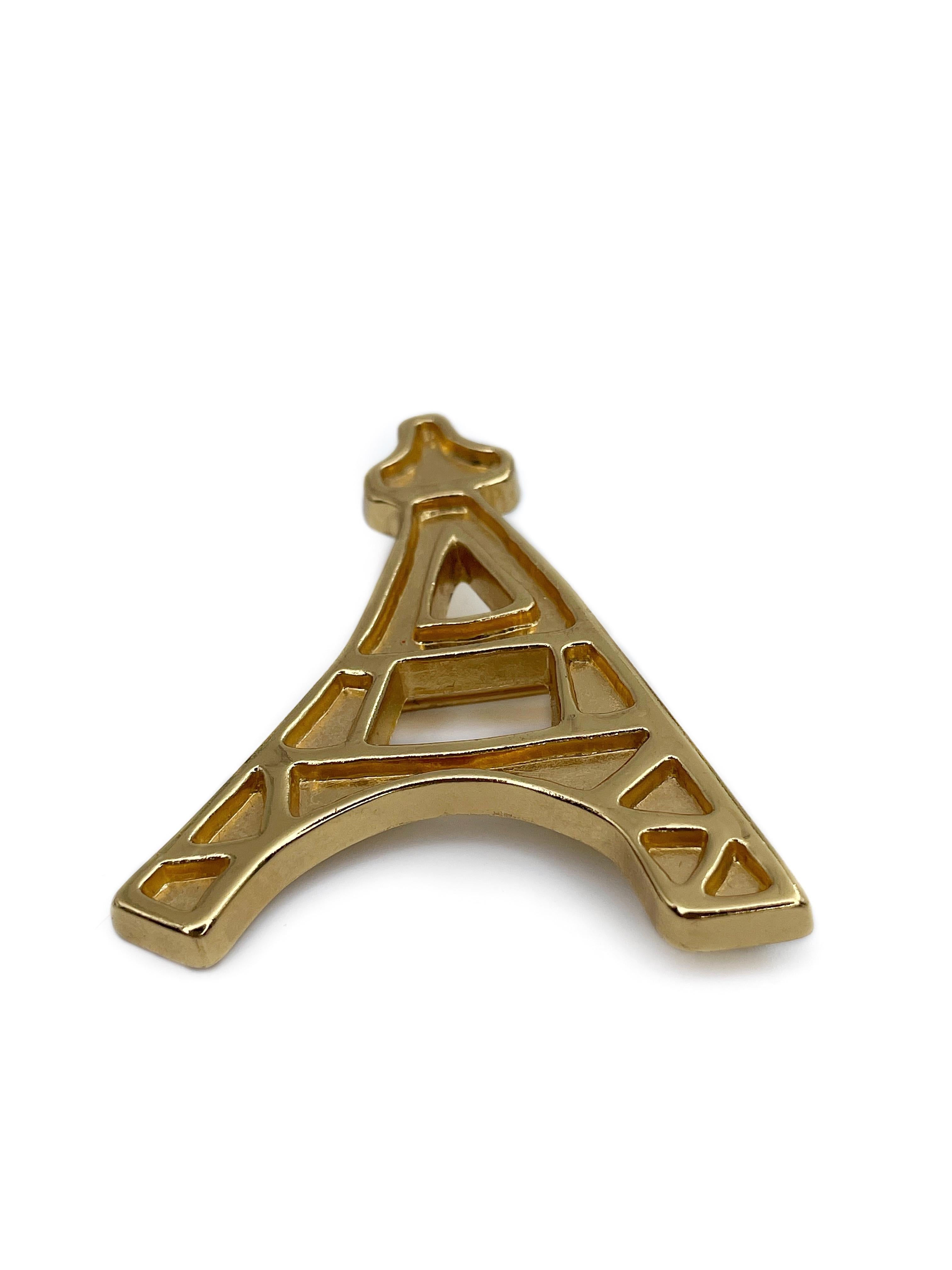 This is a subtle gold tone vintage pin brooch depicting the silhouette of the Eiffel tower. This piece is gold plated, designed by YSL in 1980’s.

Markings: “YSL. Made in France” (shown in photos).

Size: 5.5x4.3cm

———

If you have any questions,