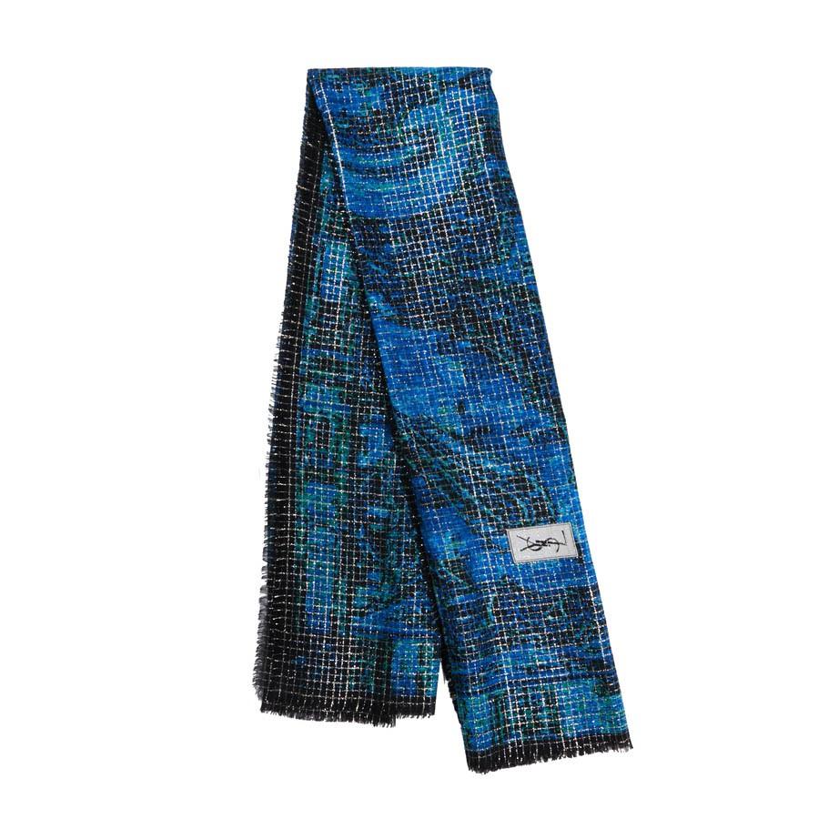 An iconic piece from YSL, the large shawl with lurex threads on a blue kashmir designed background. With fringe around the edges and stamped YSL. Note the composition label is not present but it seems to be coton. Measures: 134 cm x 128 cm. Will be