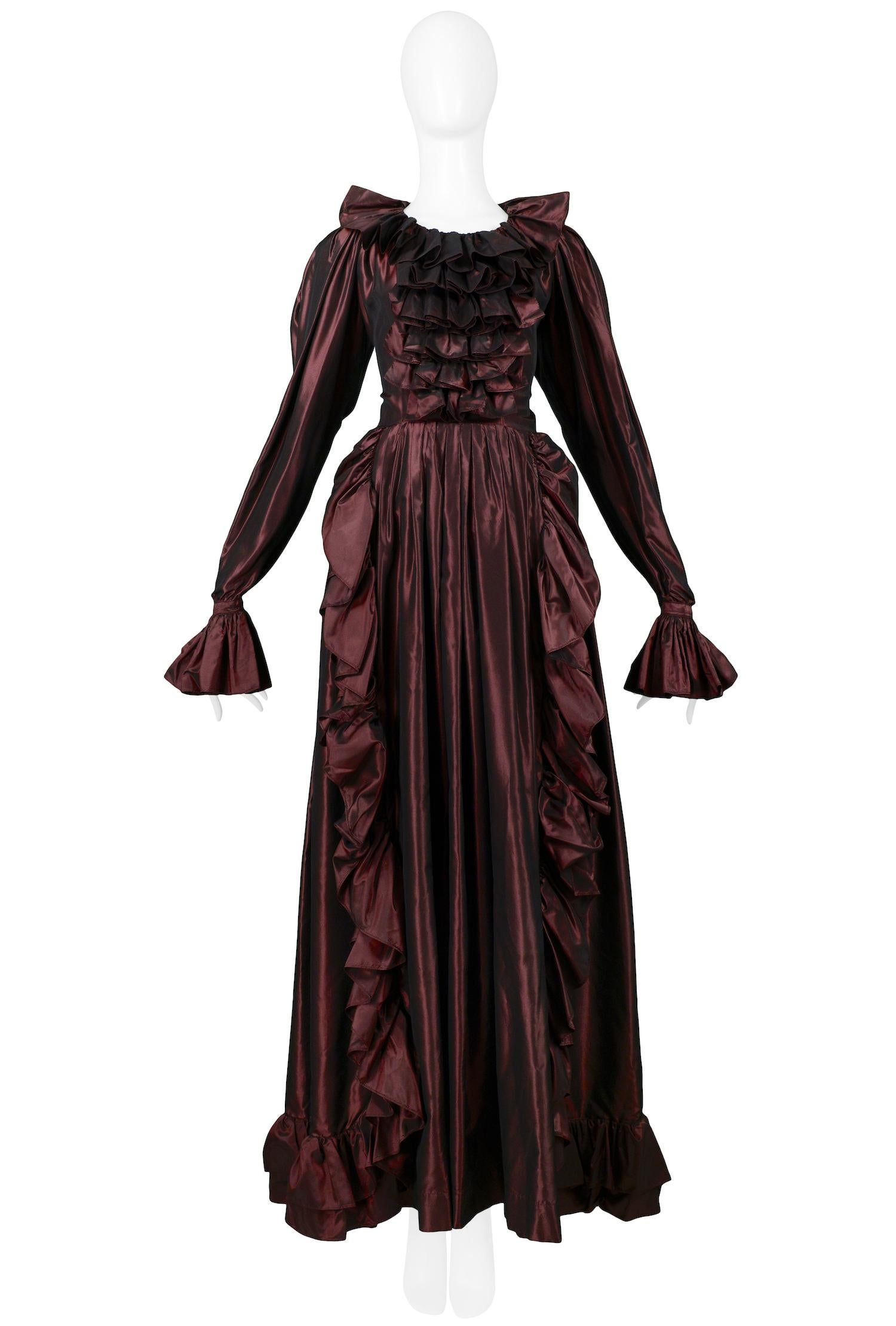 Vintage Yves Saint Laurent metallic burgundy taffeta ball gown featuring ruffles adorning the torso, collar, cuffs and skirt.

Excellent Vintage Condition.

Size 42