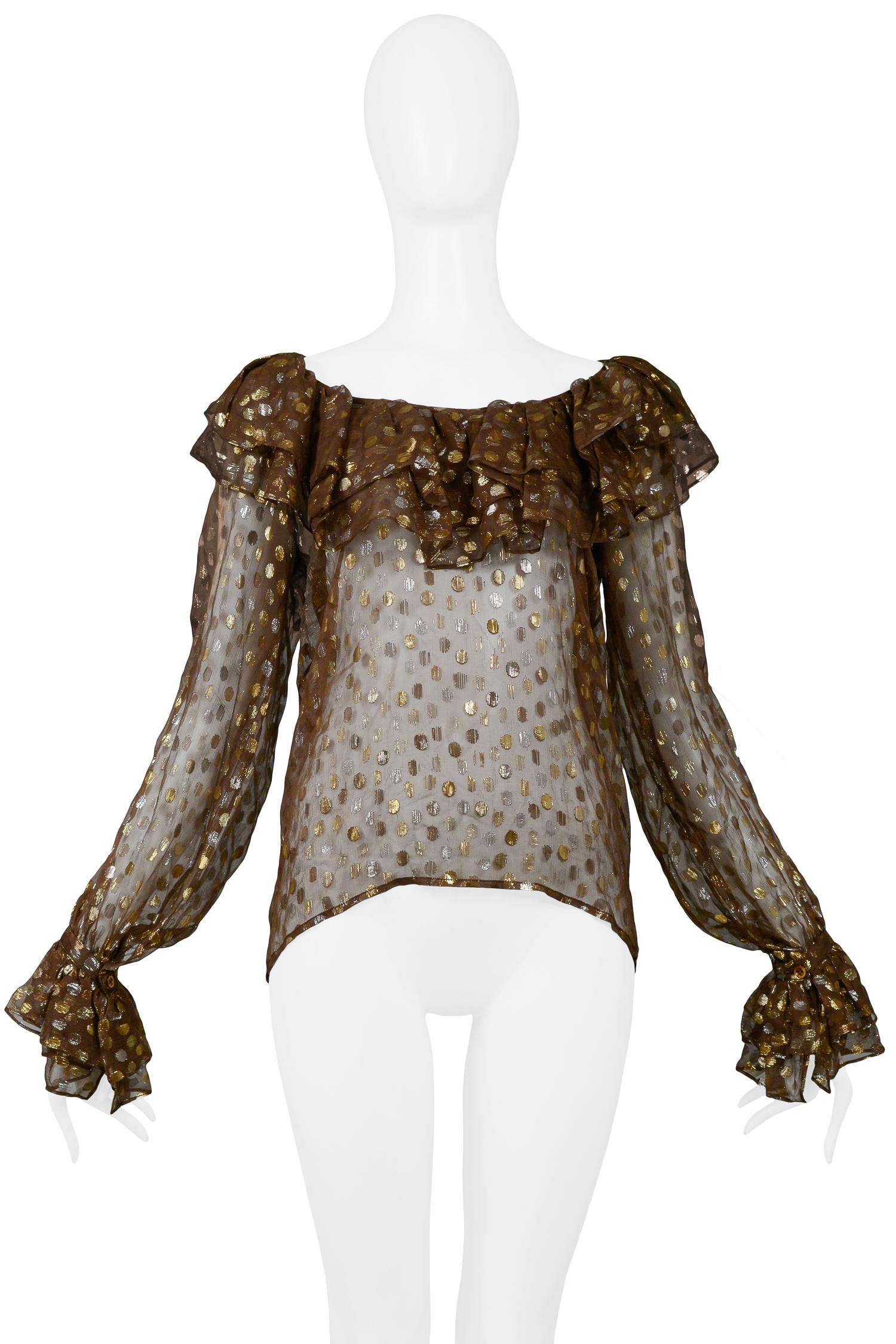 Vintage Yves Saint Laurent brown chiffon blouse featuring a metallic print of gold & silver dots, blouson sleeves with layered ruffle detail at wrists and neckline. 

Excellent Condition.

Size 38