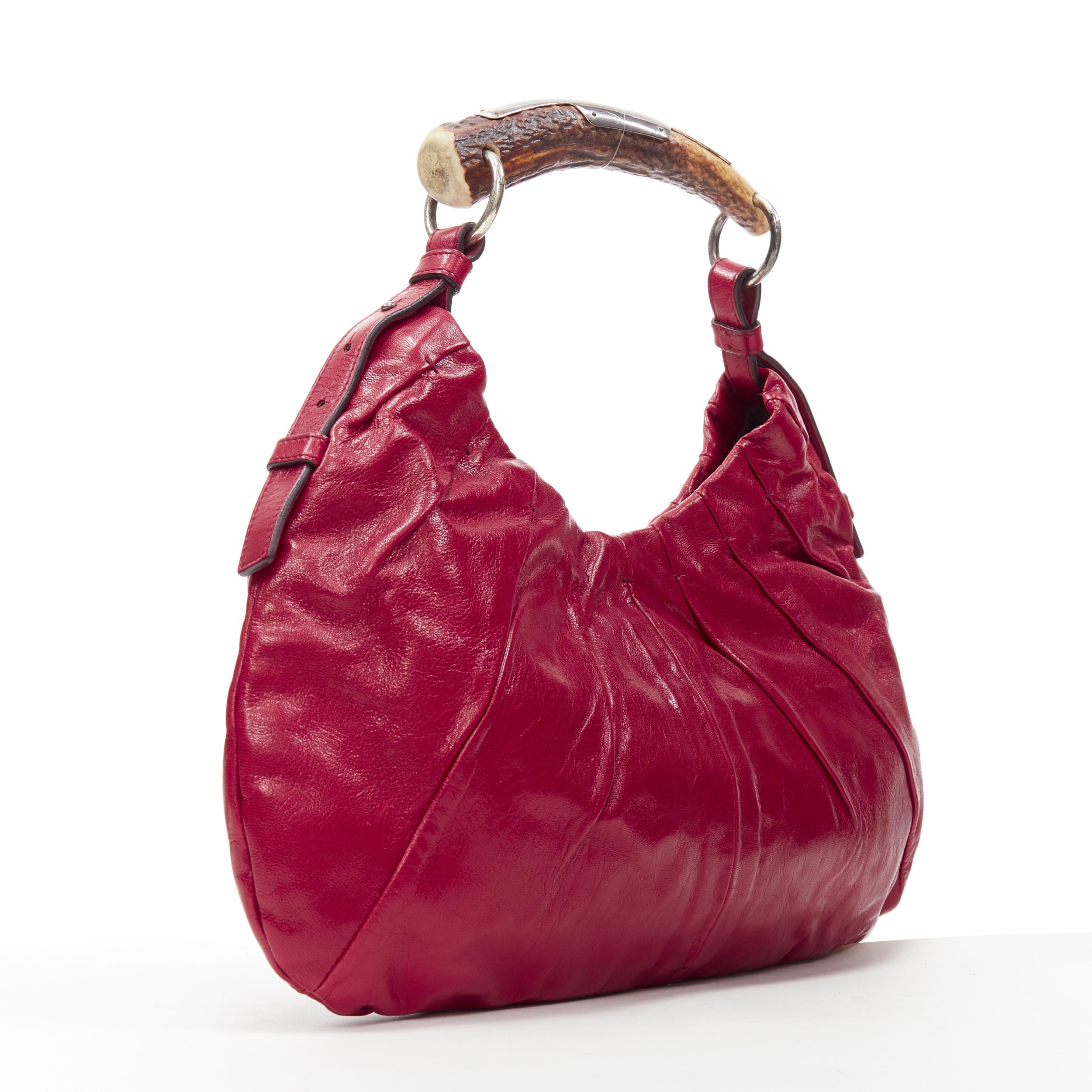 vintage YVES SAINT LAURENT Mombasa horn handle red leather shoulder hobo bag
Brand: Yves Saint Laurent
Model Name / Style: Mombasa
Material: Leather
Color: Red
Pattern: Solid
Closure: Magnetic
Extra Detail: Antique finish silver hardware.
Made in:
