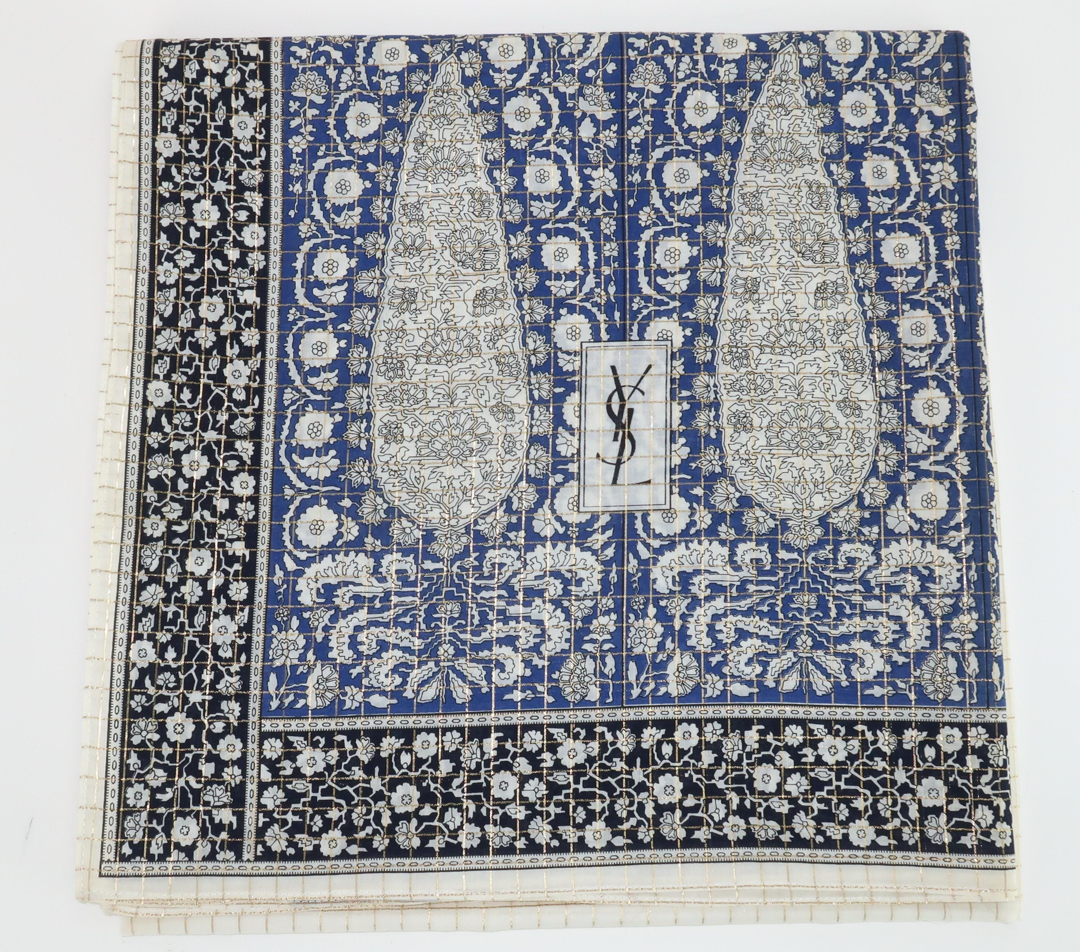 Vintage Yves Saint Laurent extra large cotton scarf in a combination of black, blue, gold lame and natural white shades with a Moroccan inspired paisley design. Both labeled and hallmarked with 'YSL' signature to the fabric. Large enough to wear as