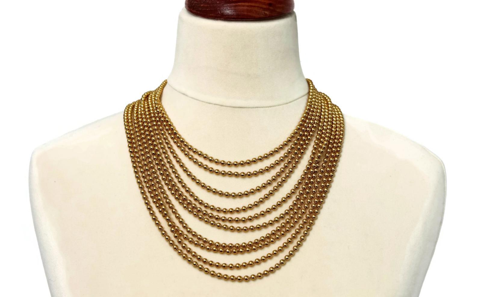 Vintage YVES SAINT LAURENT Multi Layer Chain Necklace

Measurement:
Wearable Length: 17 inches

Features:
- 100% Authentic YVES SAINT LAURENT.
- Massive necklace with 10 layers of Bead/ Ball Chain.
- YVES SAINT LAURENT signature twice on the bar