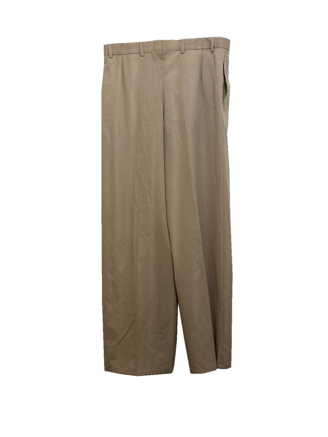 A chic vintage pant suit by Yves Saint Laurent , Rive Gauche dating from 1987. The jacket is in an ivory wool , with a single button fastening. There are pockets at hip leval, and attractive stitch detail on the collar. The jacket has all the