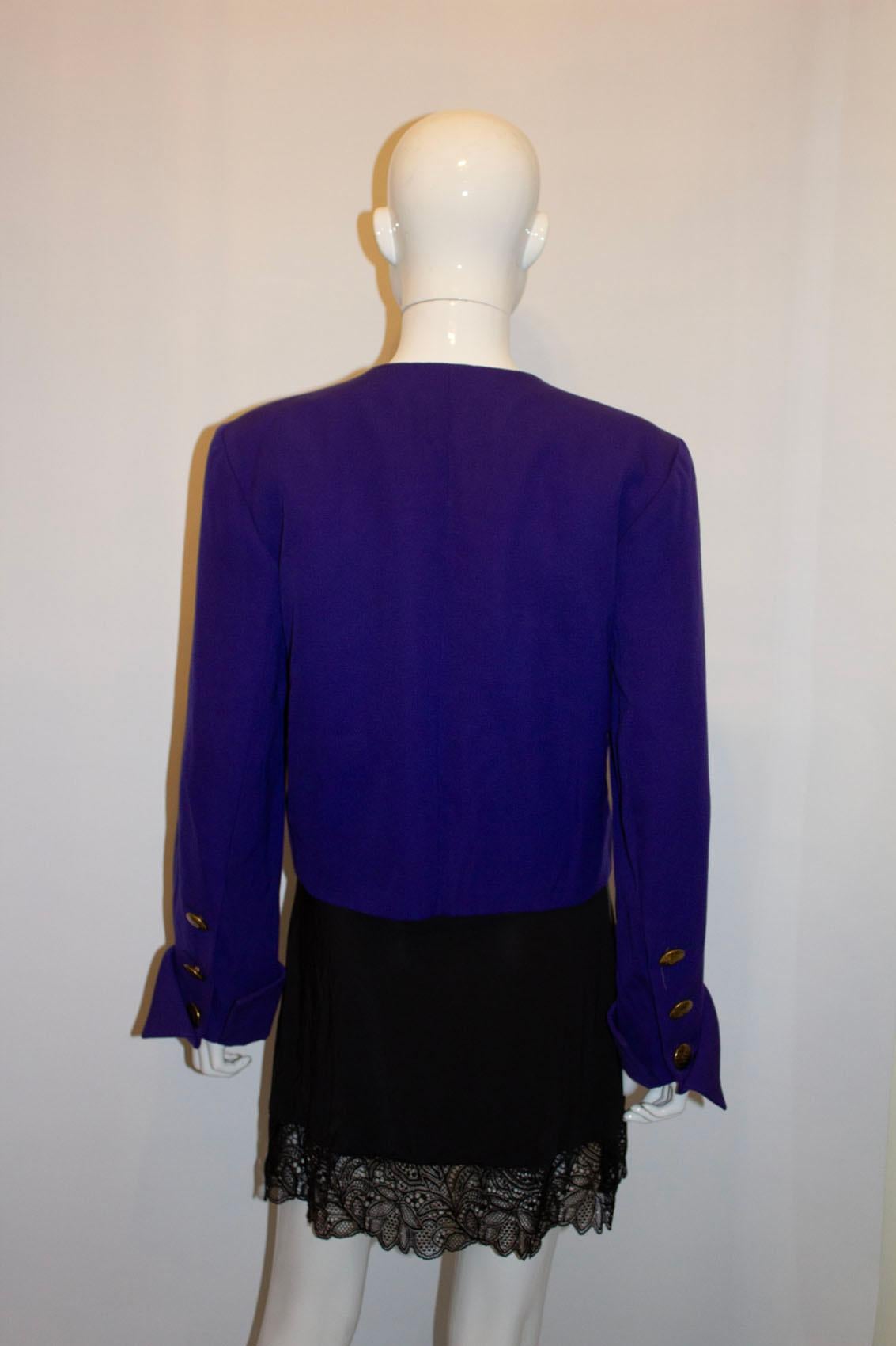 A vintage statement jacket by Yves Saint Laurent , Rive Gauche ( main line). In a head turning purple colour, the jacket is collarless and has a four button front opening and a three button cuff. It is fully lined.  Size 36 Measurements Bust up to