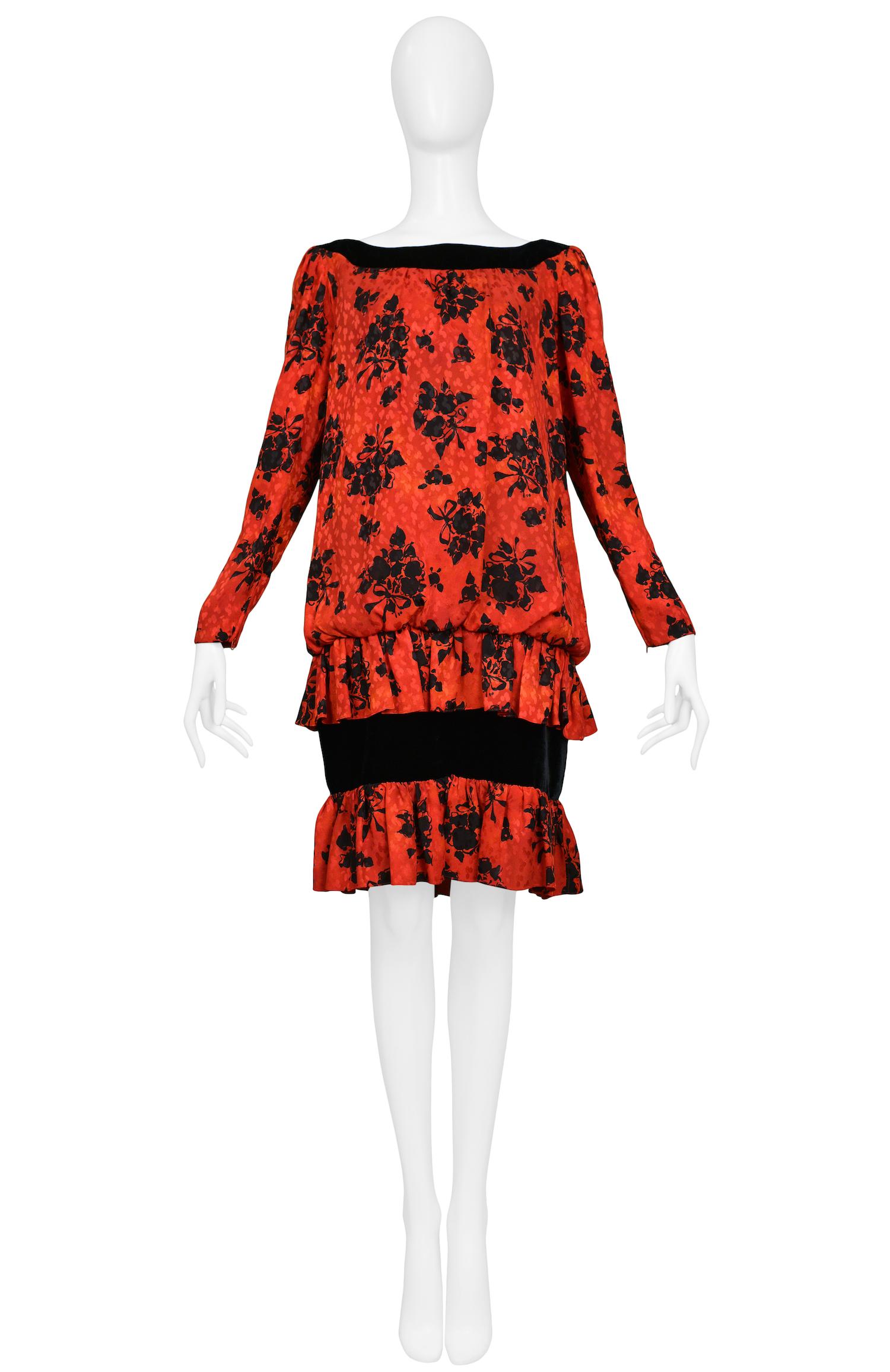 Resurrection Vintage is excited to offer a vintage black floral print Yves Saint Laurent red silk drop waist dress with velvet detailing. The dress features an open neck, straight sleeves, and knee-length.

Yves Saint Laurent
Size 38
Silk and