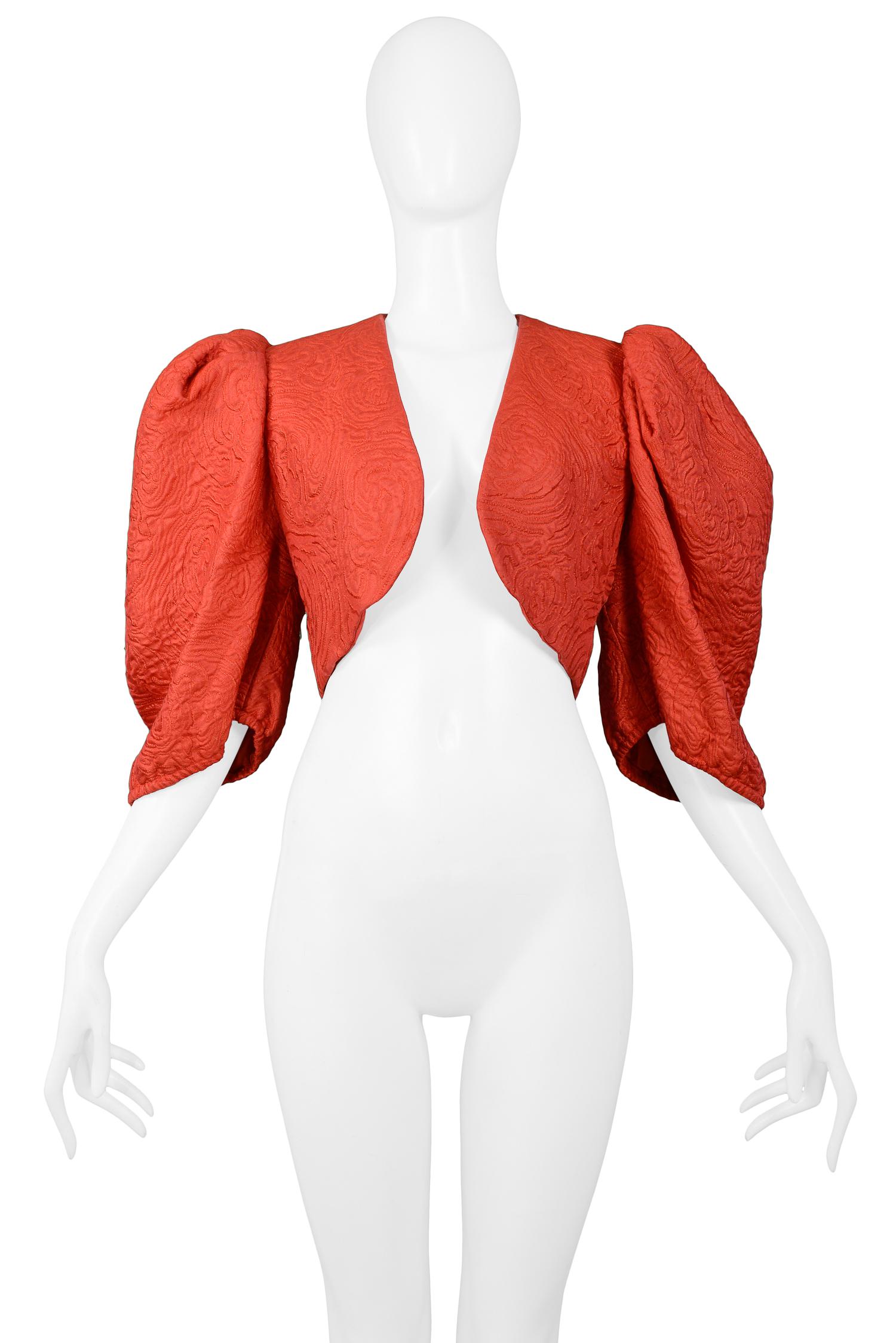 Vintage Yves Saint Laurent red fancy open front bolero jacket in jacquard fabric with dramatic puff sleeves.

Excellent Vintage Condition.

Size: 40

Measurements:
Shoulder 14